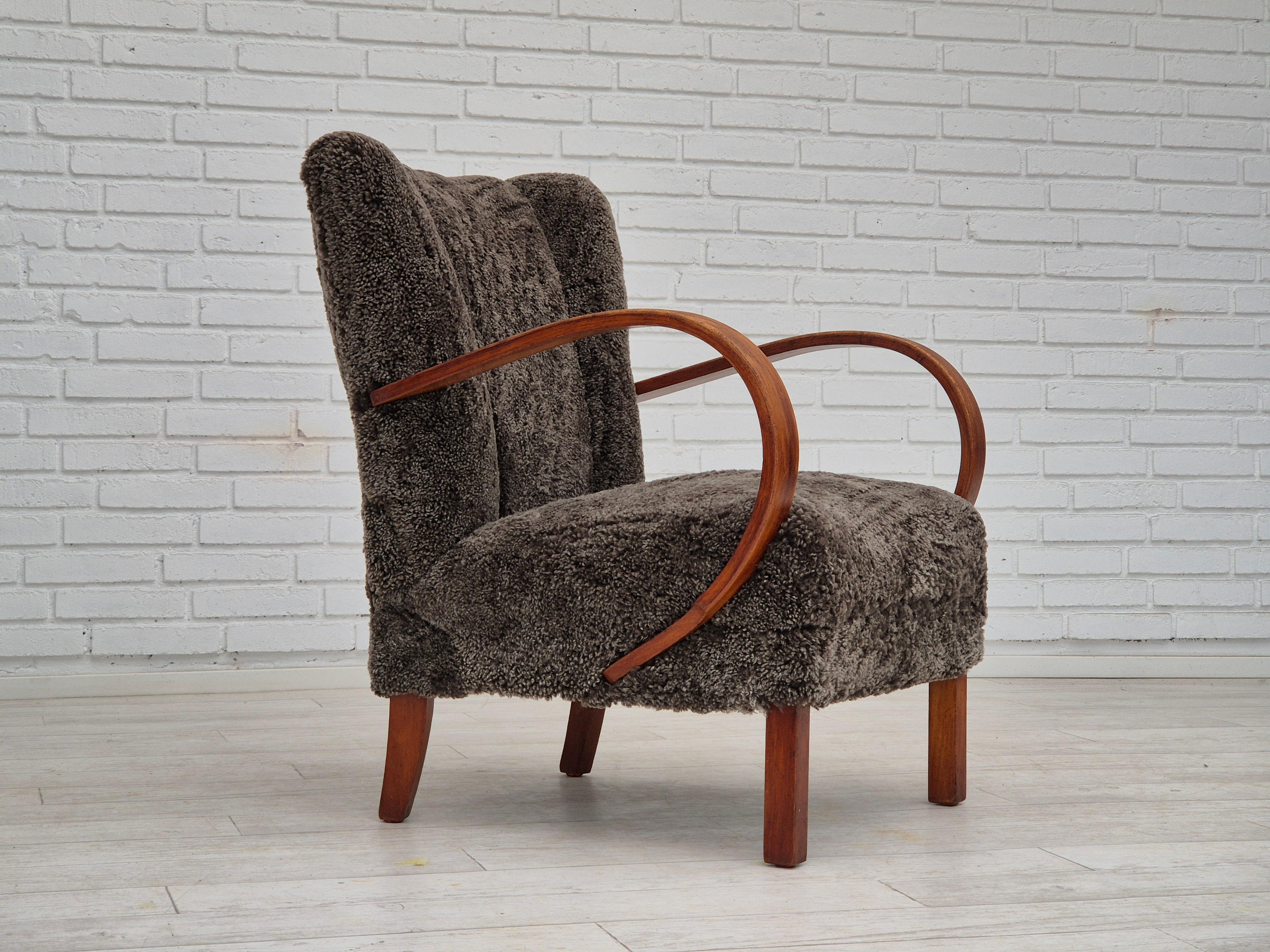 1950s, reupholstered Danish art-deco armchair. Quality Nevotex natural New Zealand sheepskin 