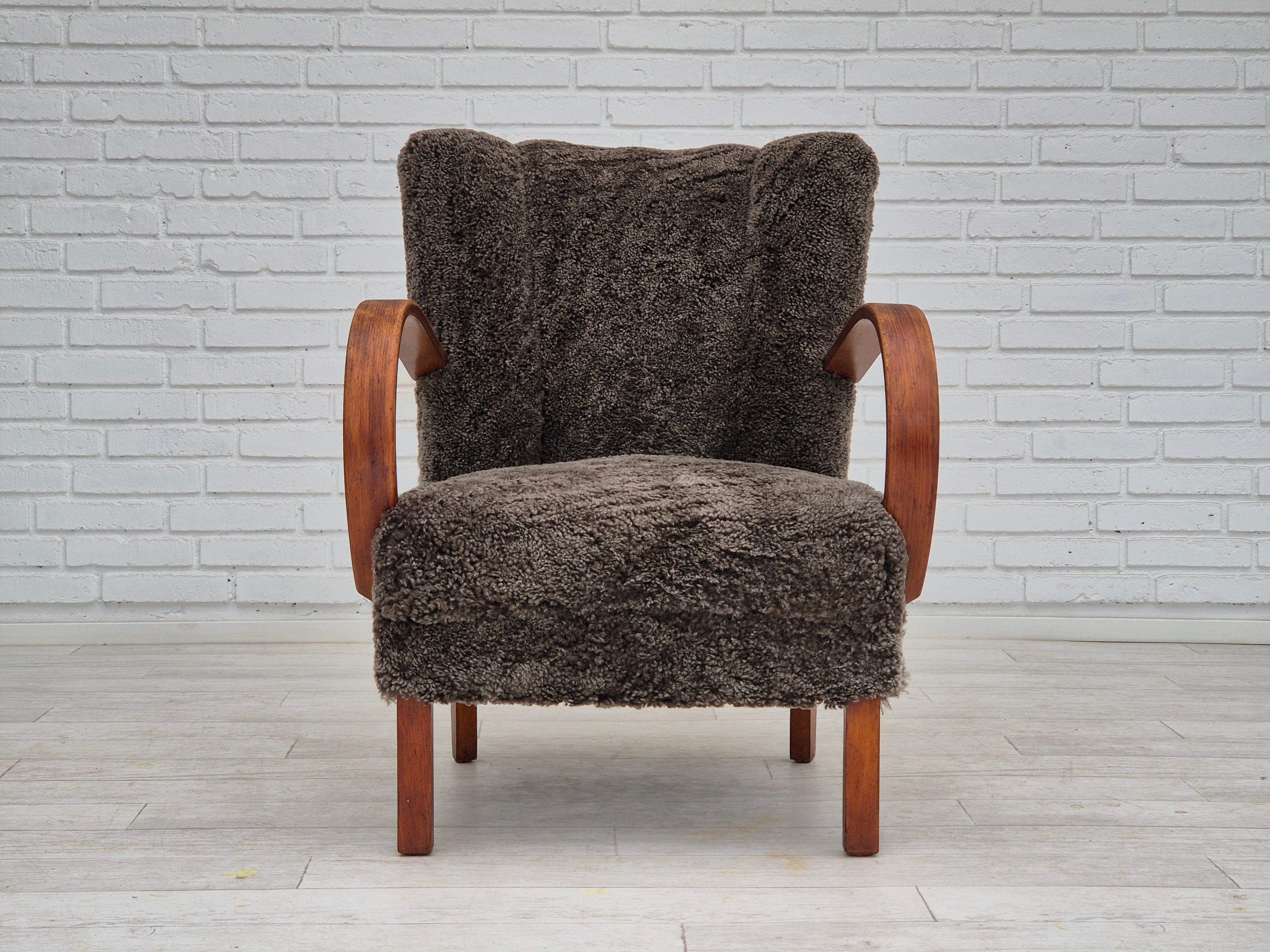 Scandinavian Modern 1950s, Danish design, refurbished armchair, geniue sheepskin 