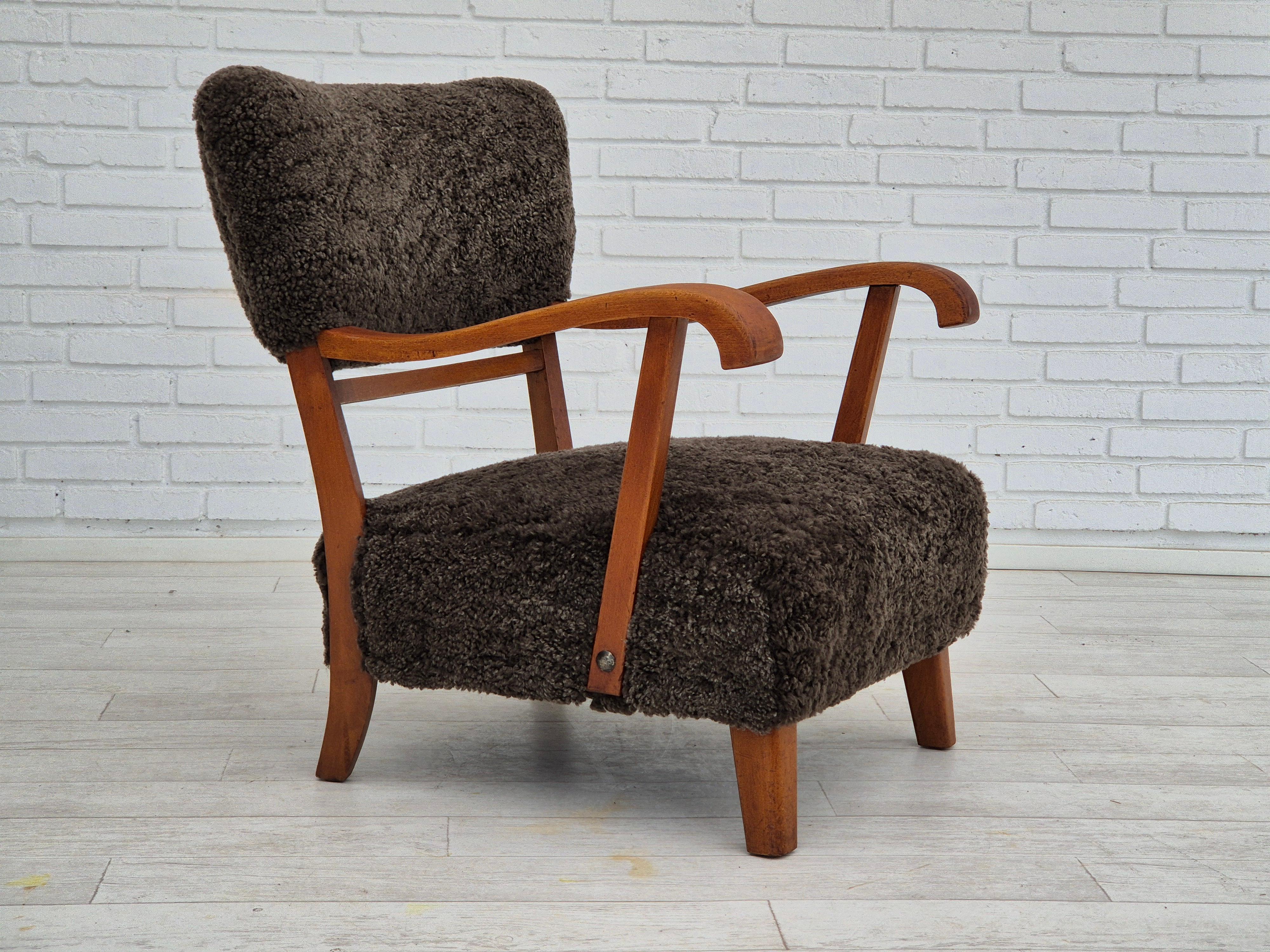 1950s, Danish design. Completely refurbished-reupholstered armchair in quality Nevotex natural New Zealand sheepskin 