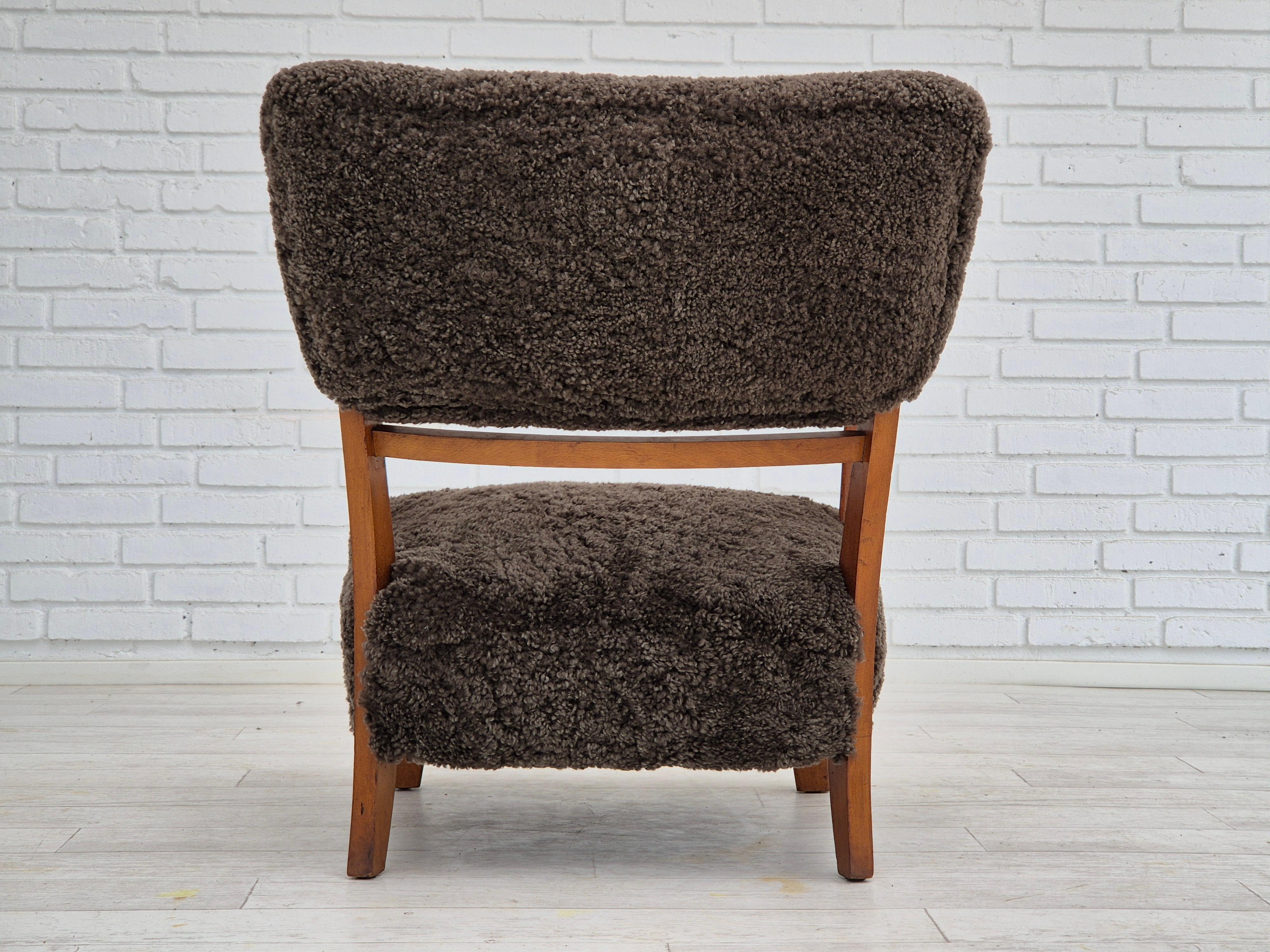 Beech 1950s, Danish design, refurbished armchair, genuine sheepskin. For Sale