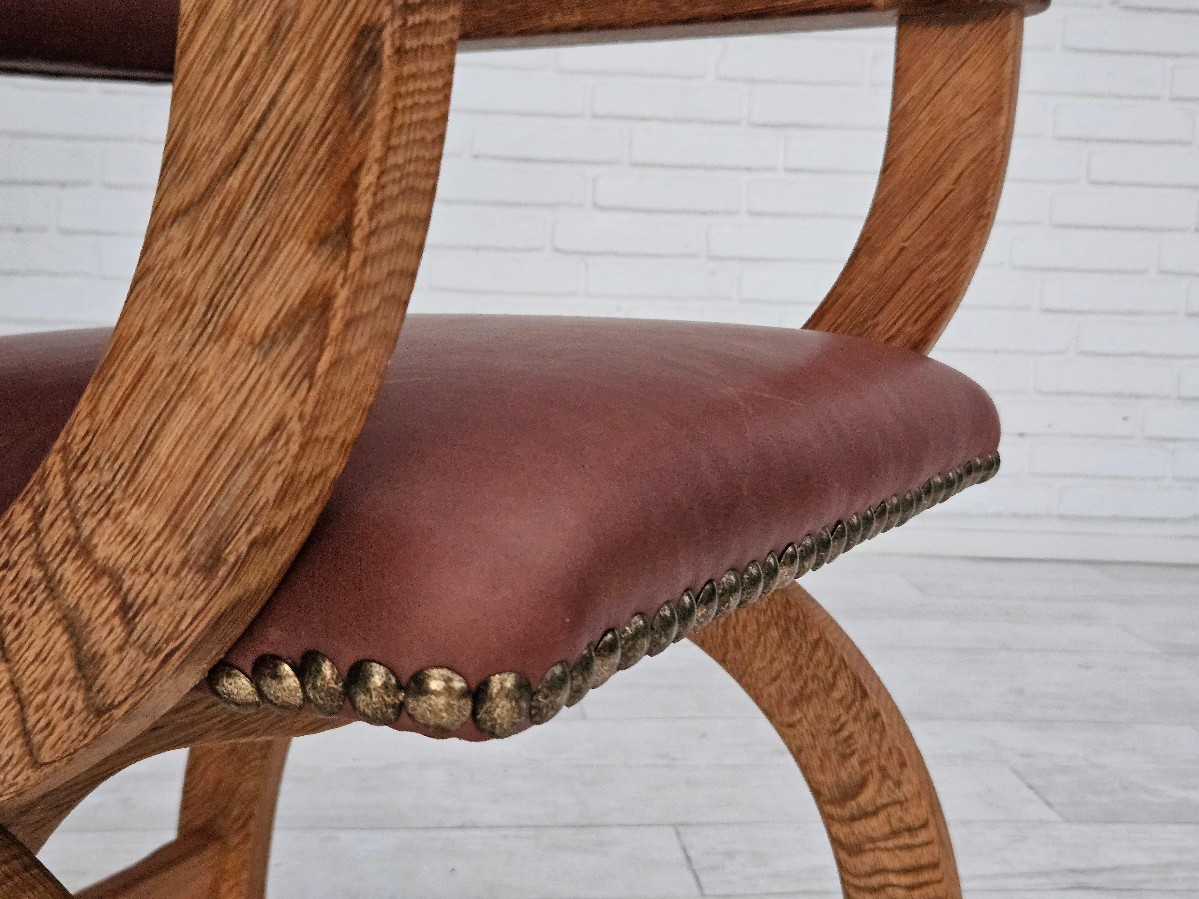 Scandinavian Modern 1950s, Danish design, reupholstered armchair, natural brown leather, oak wood. For Sale