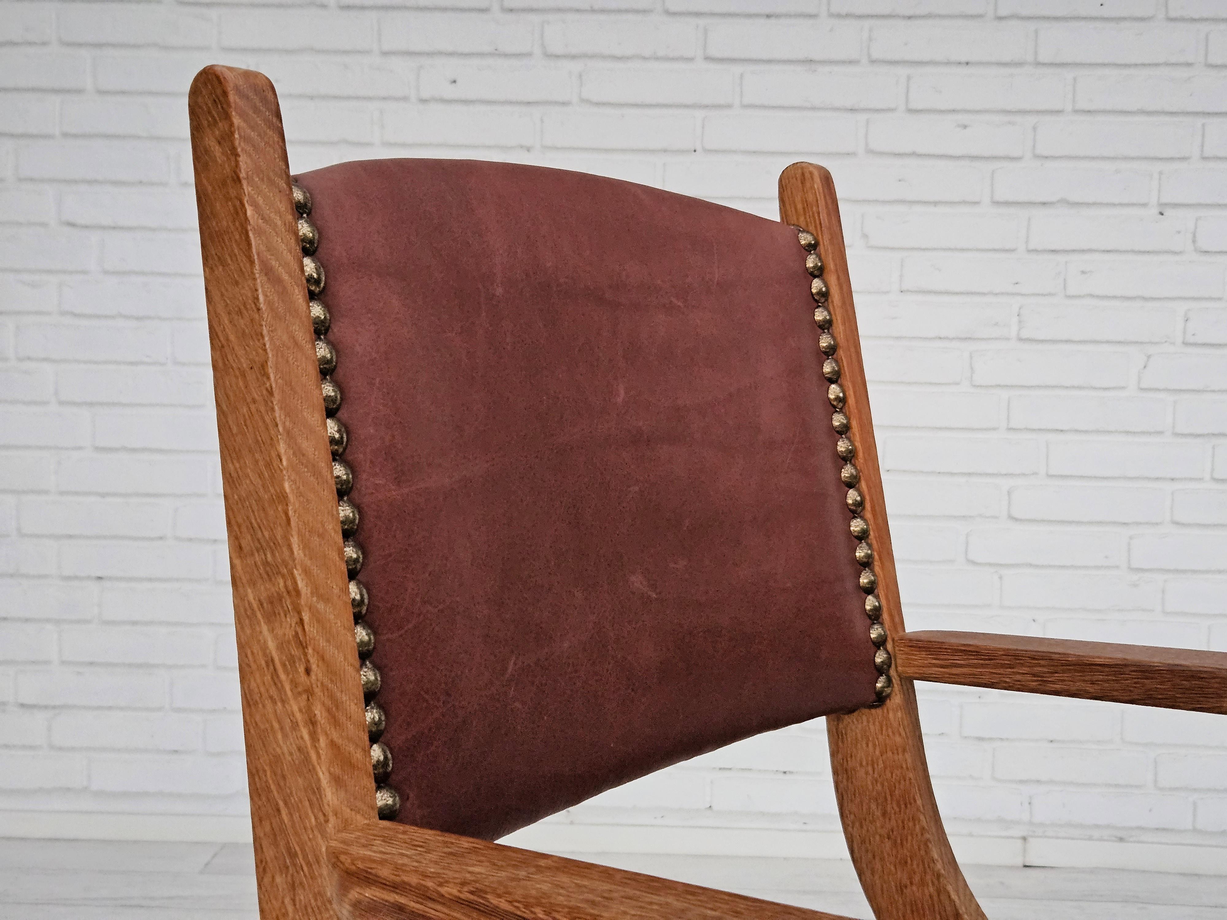 Mid-20th Century 1950s, Danish design, reupholstered armchair, natural brown leather, oak wood. For Sale