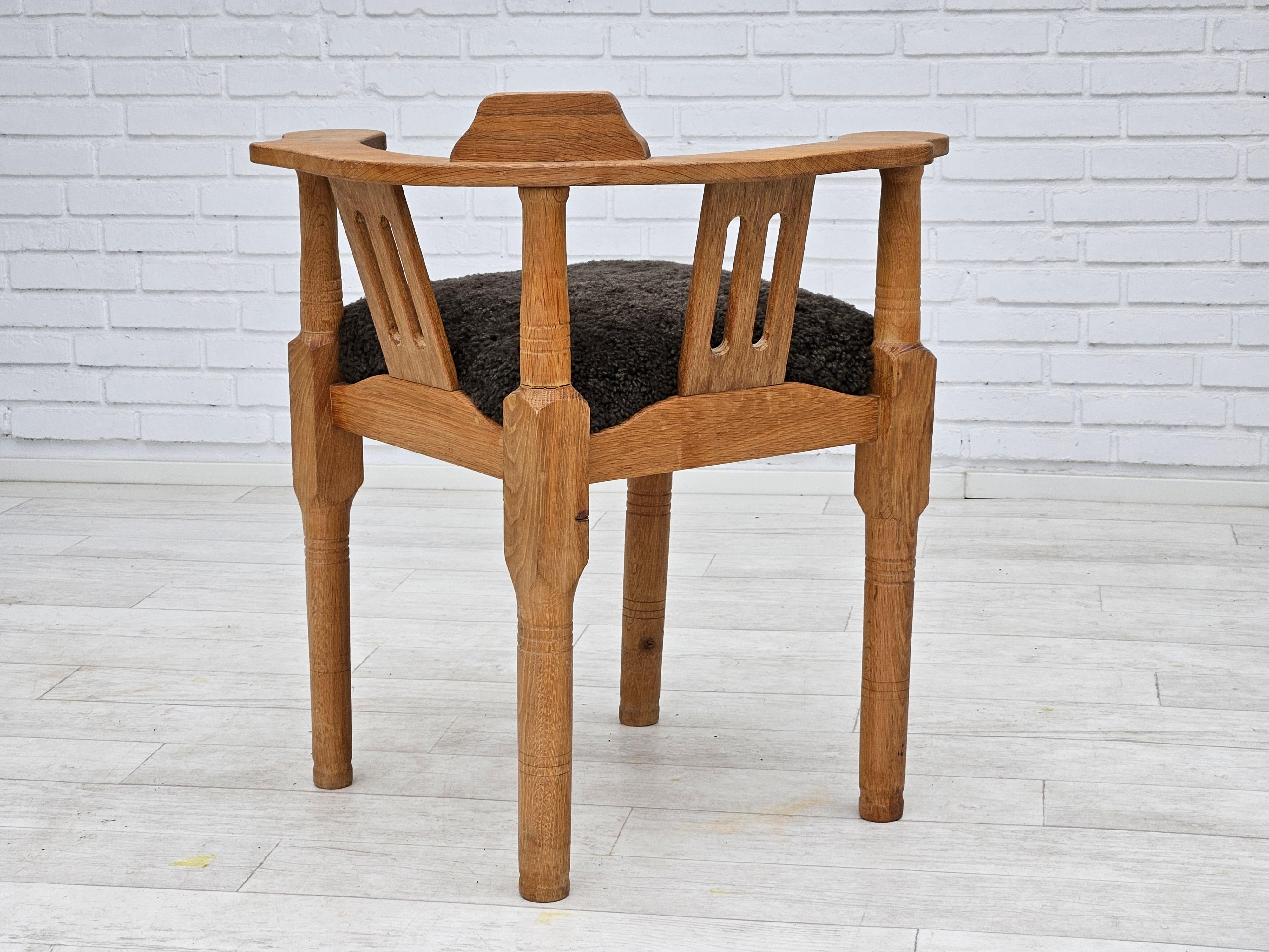 1950s, Danish design, reupholstered armchair, New Zealand sheepskin, oak wood. For Sale 1