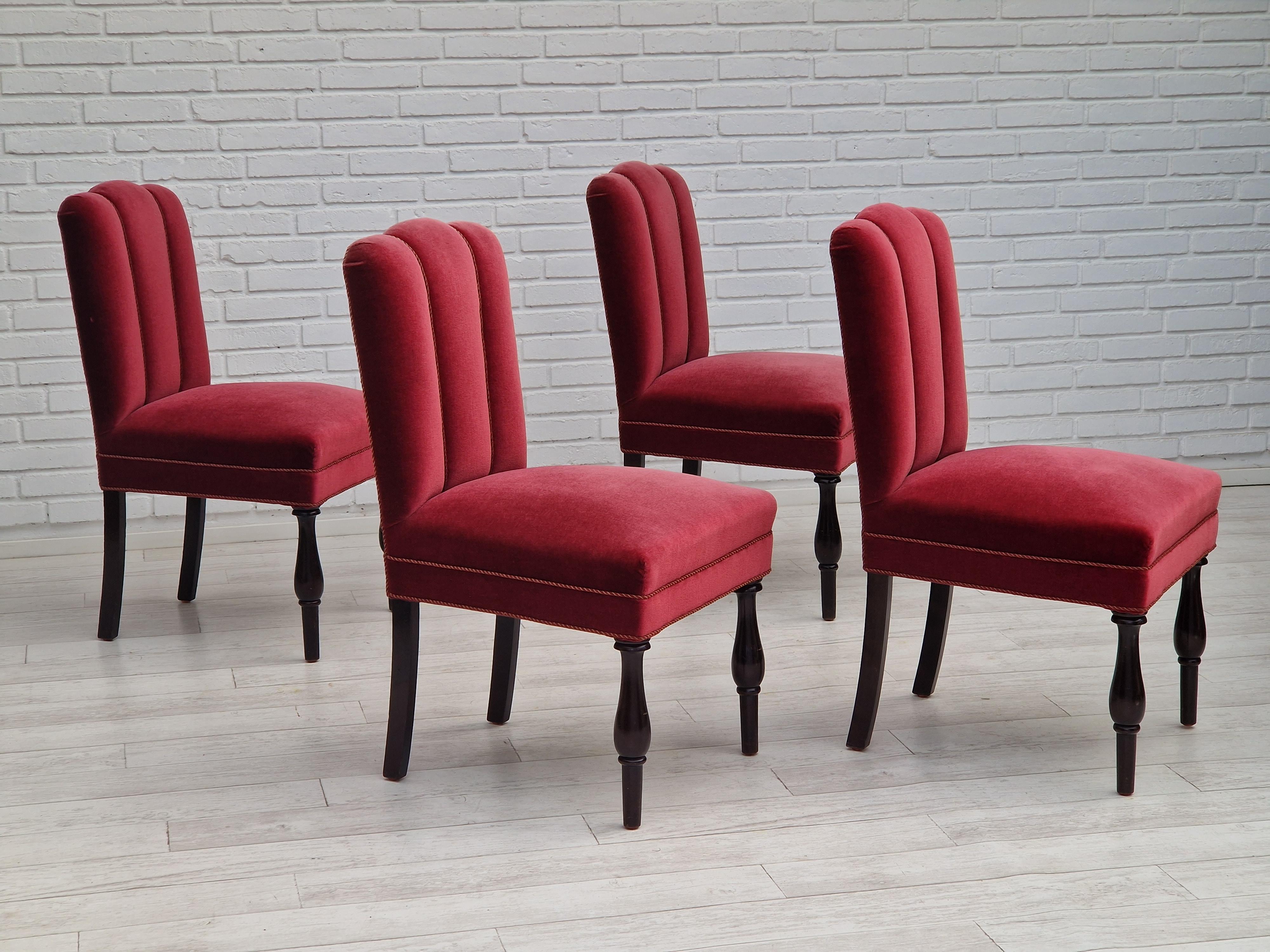 Original Danish design from about 1950s. Set of 4 dinning chairs, oak wood, cherry-red velour. Made by a Danish furniture manufacturer in about 1950. Very good condition, no smells, no stains. Springs in seat.