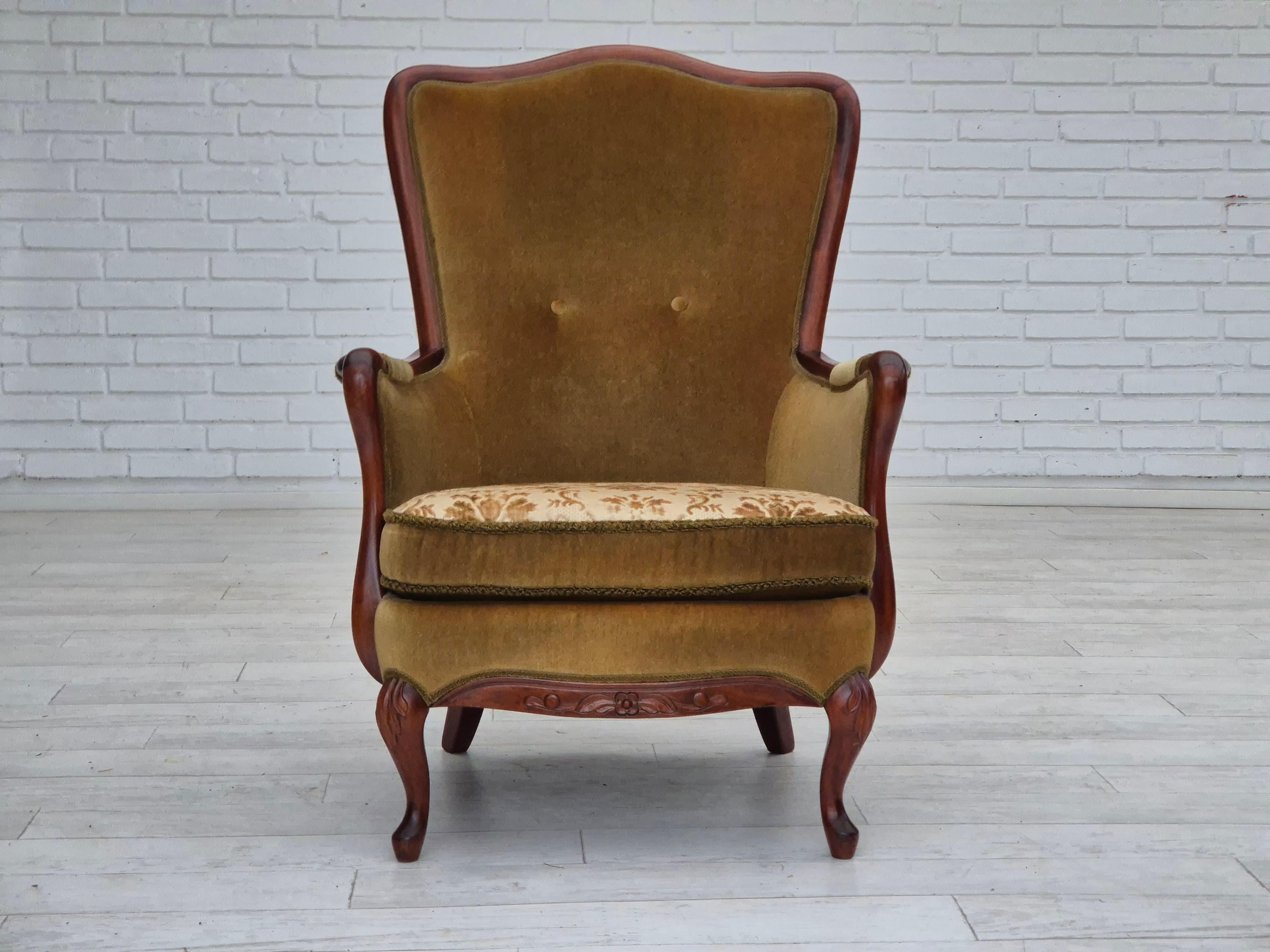 1950s, Danish armchair in original good condition: no smells. Light olive green furniture velour. Laqiered teak wood. Double-sided seat cushion. Springs in the seat cushion. Manufactured by Danish furniture manufacturer in about 1950s.