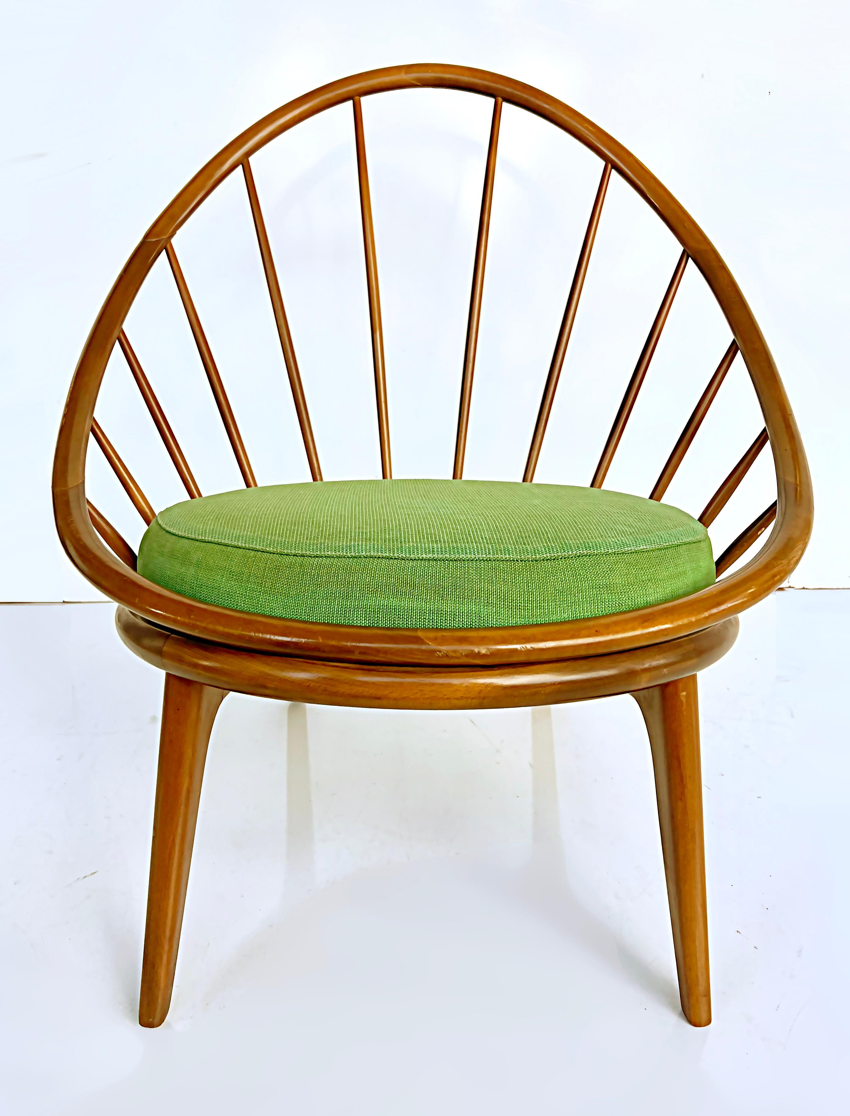 1950s Danish Modern Ib Kofod Larsen for Selig Hoop Chair with Seat Cushion

Offered for sale is a 1950s Danish Modern Ib Kofod Larsen hoop chair that is made in 
Denmark designed for Selig. The frame is walnut and a green seat cushion is provided.