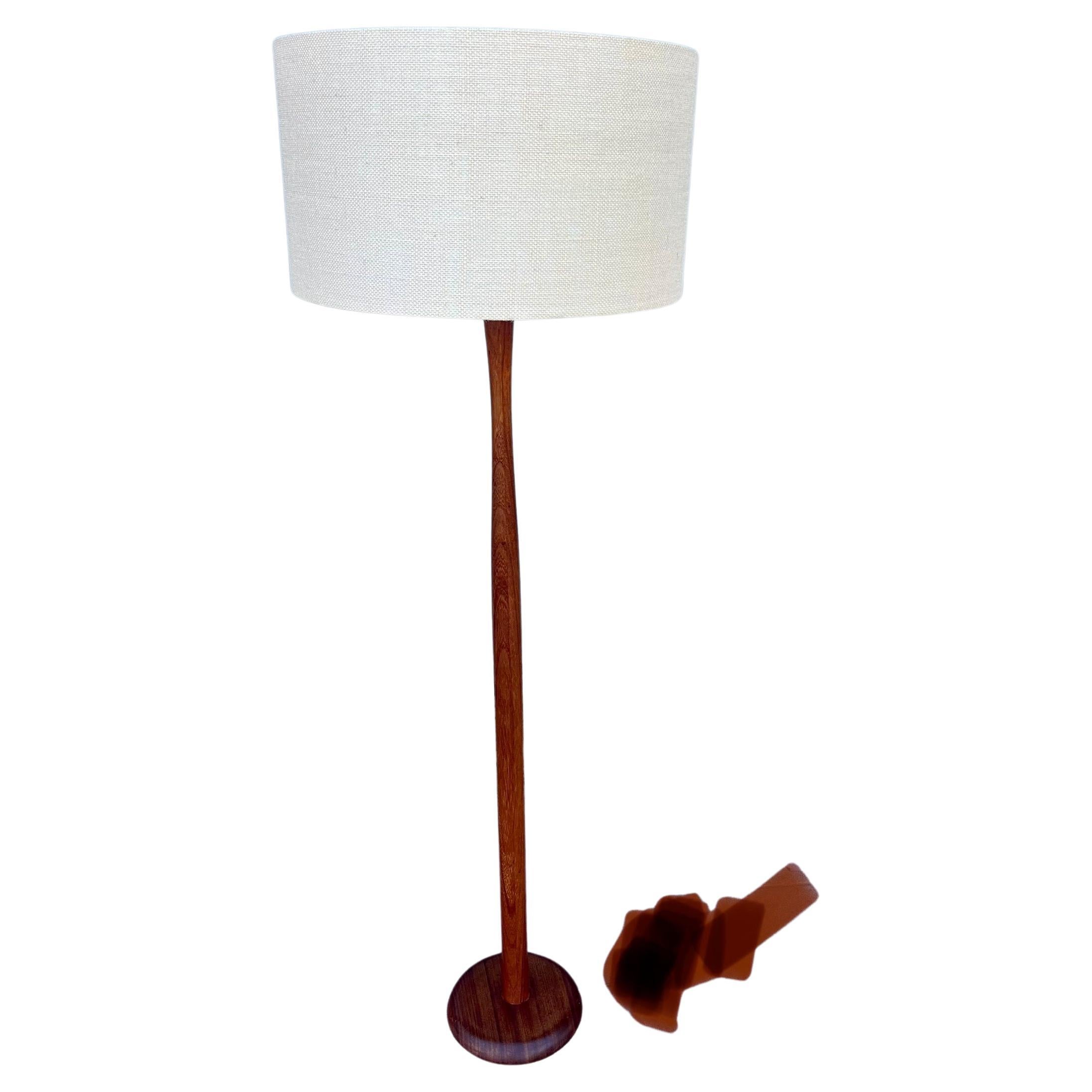 Simple elegant solid teak floor lamp, rewired, lampshade not included, its the original some wear due to age. 57
