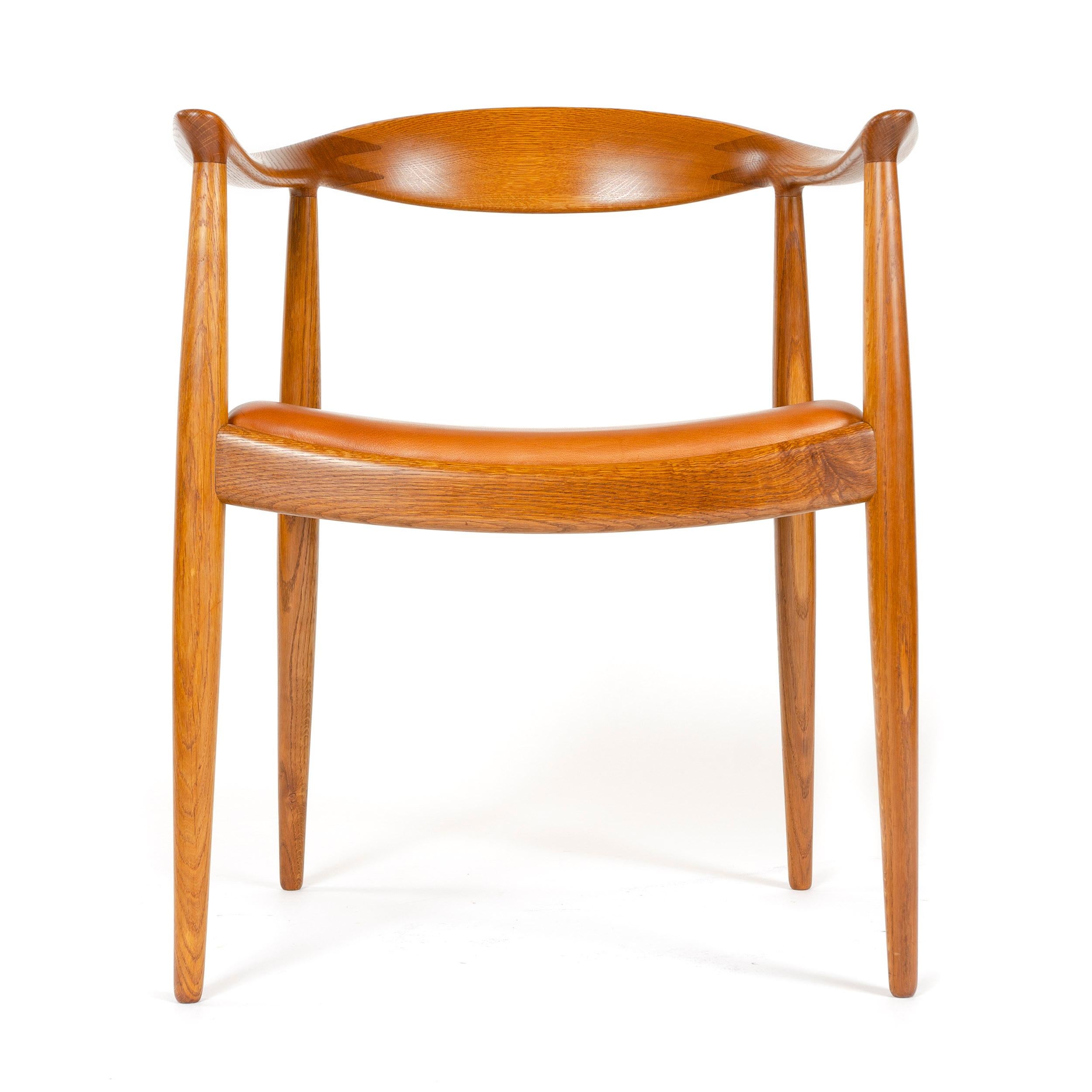 A newly upholstered oak 'round' chair produced previous to 1954, with original impressed stamp,
'Johannes Hansen COPENHAGEN DENMARK'. Model JH-501.
  