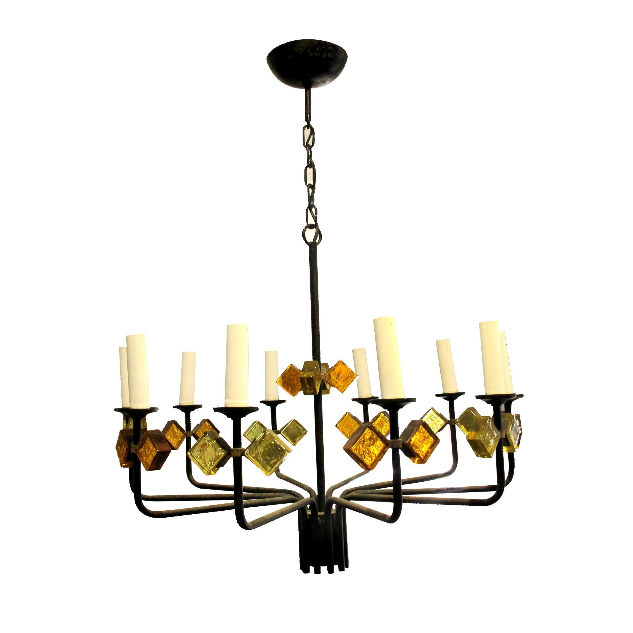 This a pair of mid-century chandeliers with yellow, amber glass and black painted frame made by Svend Aage Holm Sorensen for Holm Sorensen and Co. Each chandelier presents 10 branches fitted with E14 small screw sockets.

Size: H80 cm x Diameter 55