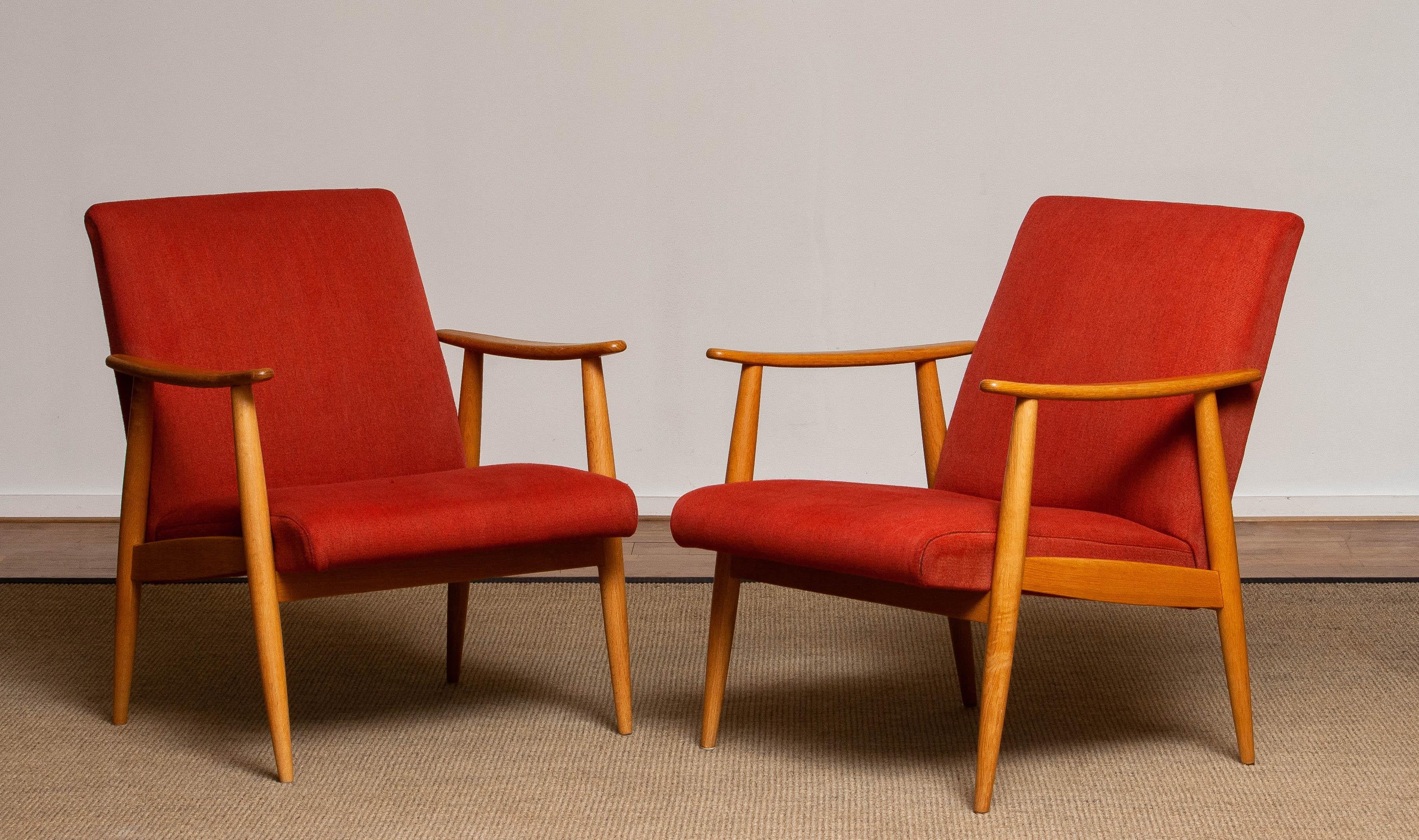 Beautiful set of two original lounge chairs 'Cigar chairs' from the 1950's covered with vintage red woolen fabric made in Denmark. The slim oak frames as well as the fabric are in very good and clean condition.

 