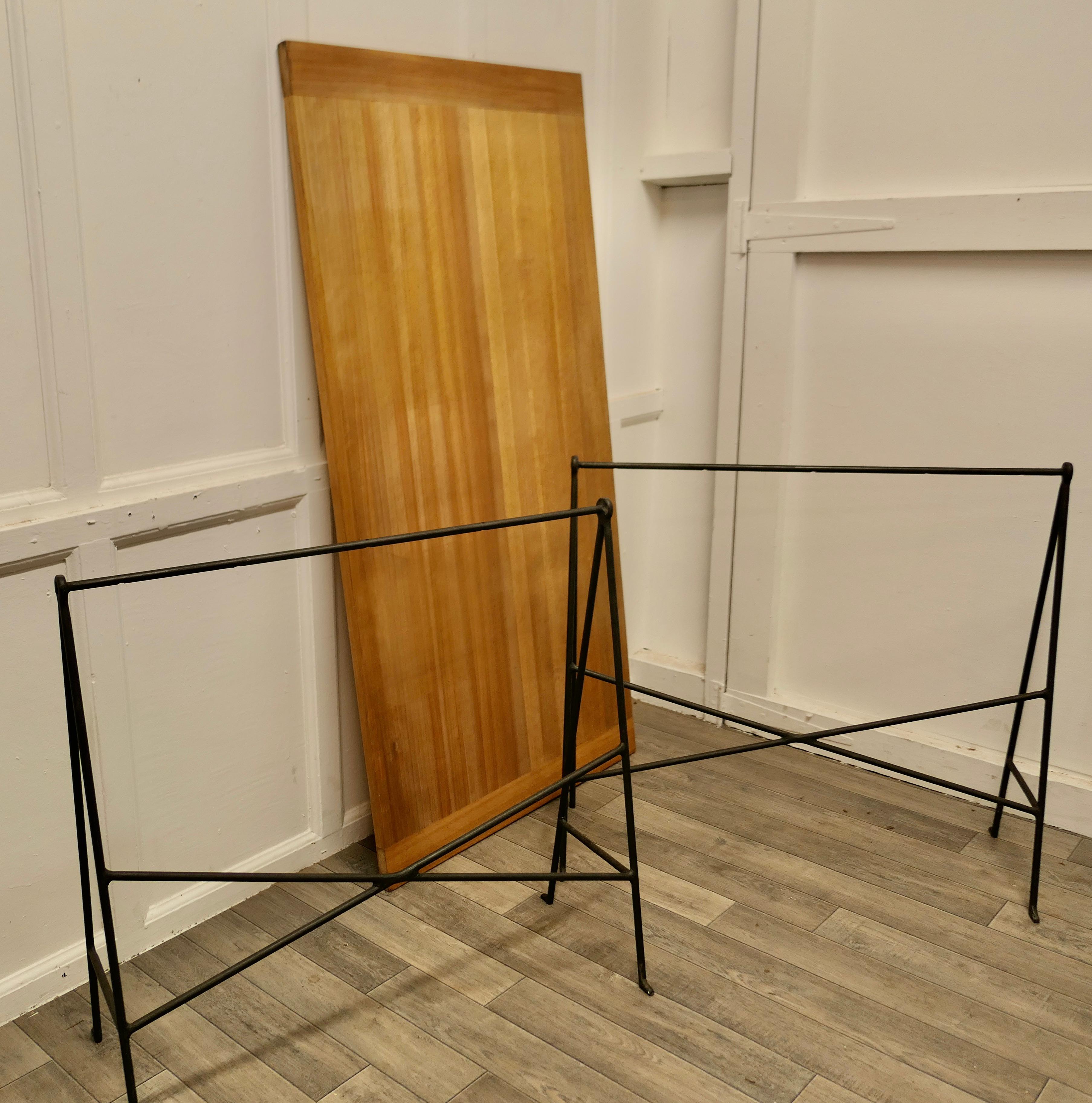1950s Danish Sawhorse Minimalist Desk or Dining Table  

1950s Danish Sawhorse Minimalist Desk or Table based on a design by Bengt Johan Gulberg
A attractive and useful classic design from the 1950s, the solid teak top with cleated ends is supported