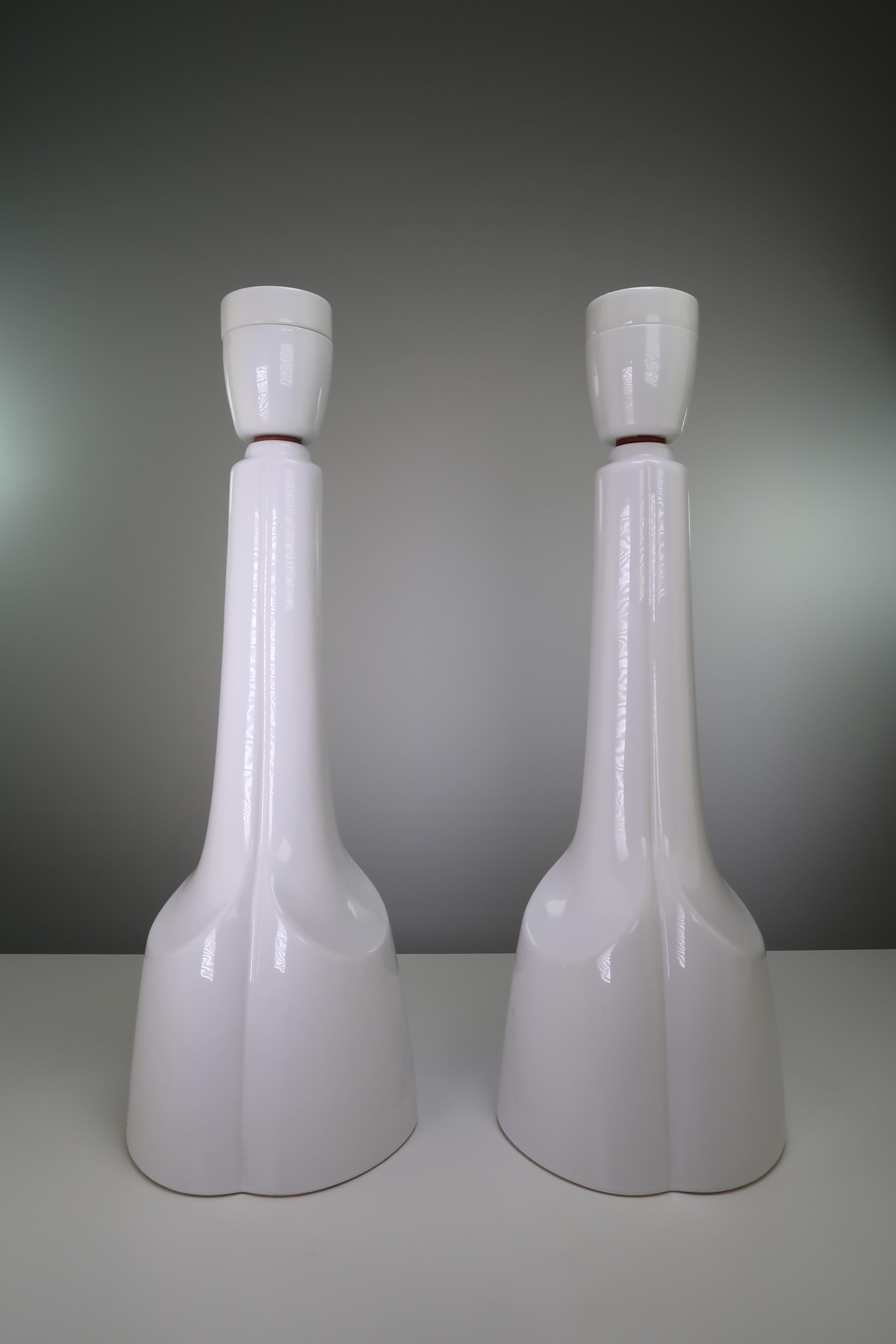 Stunning and elegant pair of tall and slender bone white Scandinavian Mid-Century Modern porcelain table lamps by Danish Søholm Stentøj. Manufactured on the small Danish island of Bornholm in the 1950s. Stamped on the base. Model 904. Rewired with
