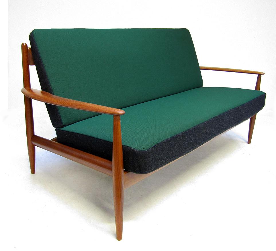 A 1950s model FD-118 sofa in teak and Kvadrat fabric by Grete Jalk for France and Daverkosen.

The earliest edition of this design, it has an elegant and streamlined form. The matching chair is also available.

The cushions have been