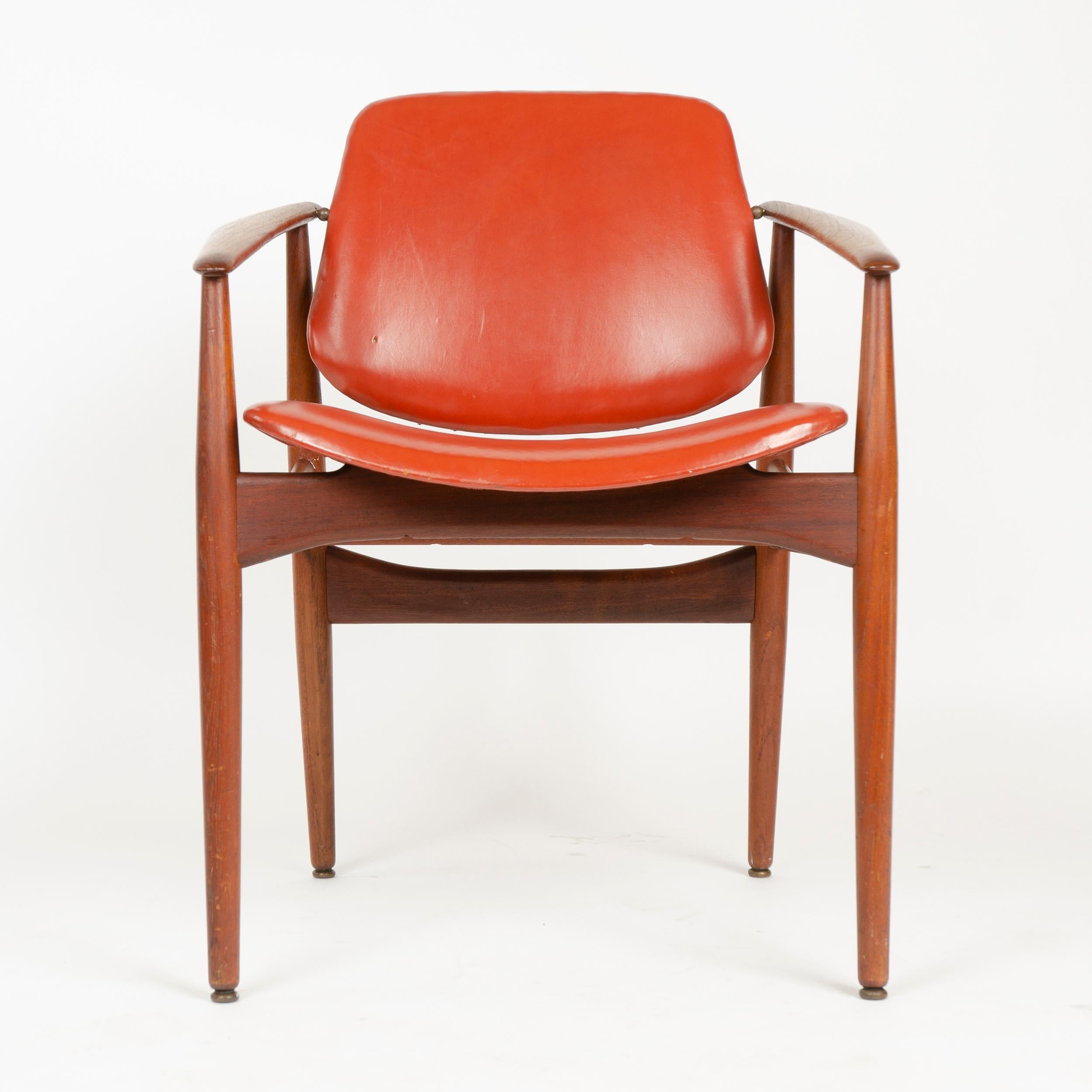 A dining chair having an exposed solid Bangkok teak frame supporting a wrapped molded seat and back, the back having a unique brass-hinged pivoting adjustment.