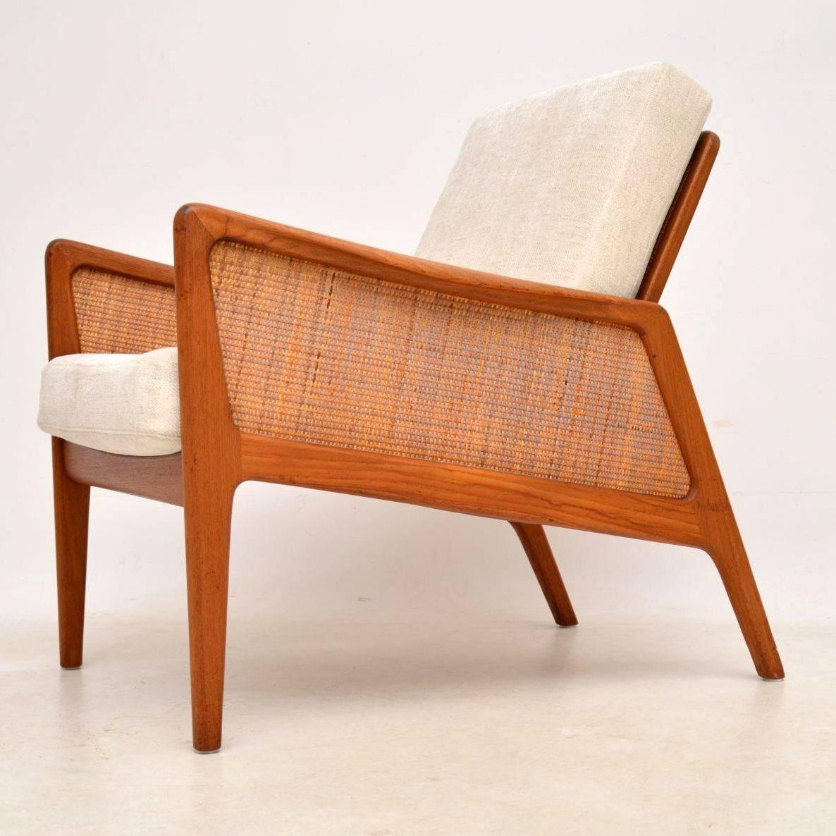 A stunning and very rare Danish vintage teak armchair, this was designed by Peter Hvidt and Orla Mølgaard-Nielsen. It was made by France and Daverkosen and it has the original badge intact, which means it can be dated to somewhere between 1953 and