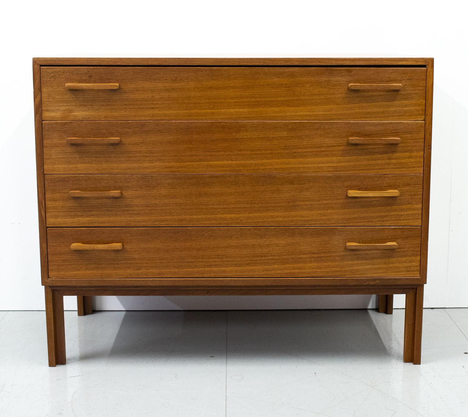 1950s Danish teak chest of drawers designed by Kai Kristiansen for Feldballes Mobelfabrik. A lovely small and practical piece with 4 drawers and solid teak handles and legs.