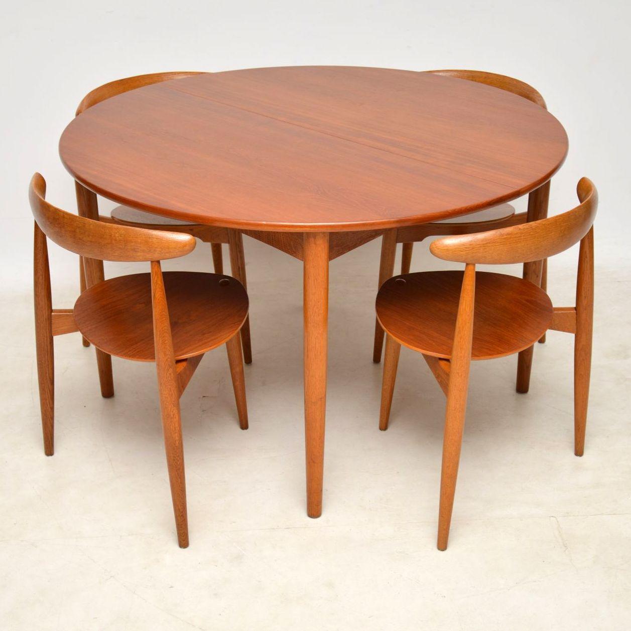 A stunning and very rare vintage dining suite designed by the famous Danish designer Hans Wegner, this was made in Denmark, circa 1950s-1960s. The chairs are often known as the ‘heart’ chairs due to the shape of the seats, they have a stunning three