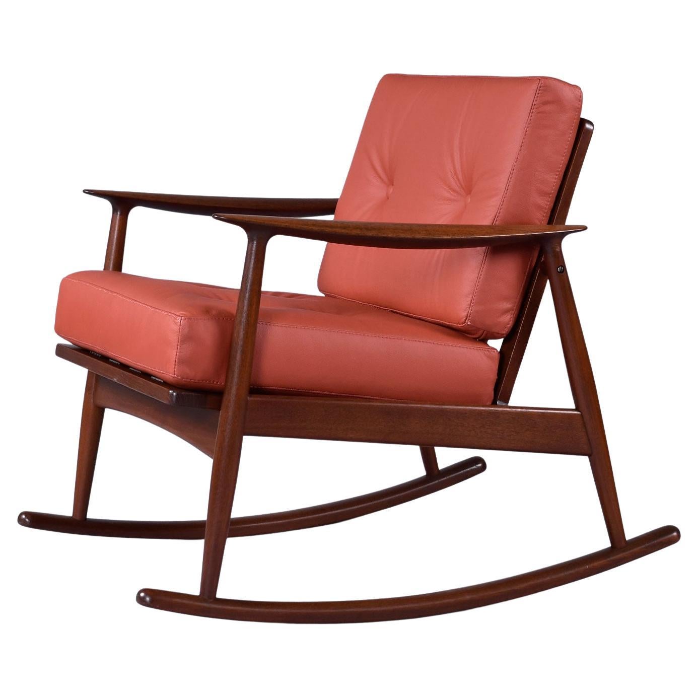 Our team restored this Danish solid teak gem from top to bottom.  Made by Moreddi, the vintage 1950s Mid-Century Modern rocker truly looks better than new with it's sexy, tailored 4-button tufted seat and back cushions. The FMV restoration team
