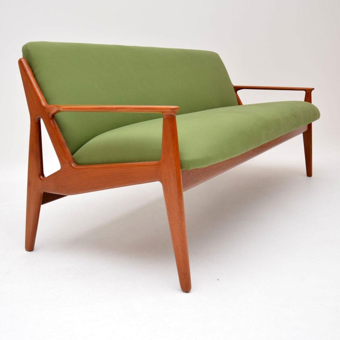 An absolutely stunning and extremely rare vintage Danish sofa in solid teak, this was designed by Arne Vodder and was made by Vamo in the 1950s-1960s. We have had the frame fully stripped and re-polished to a very high standard, we’ve also had this