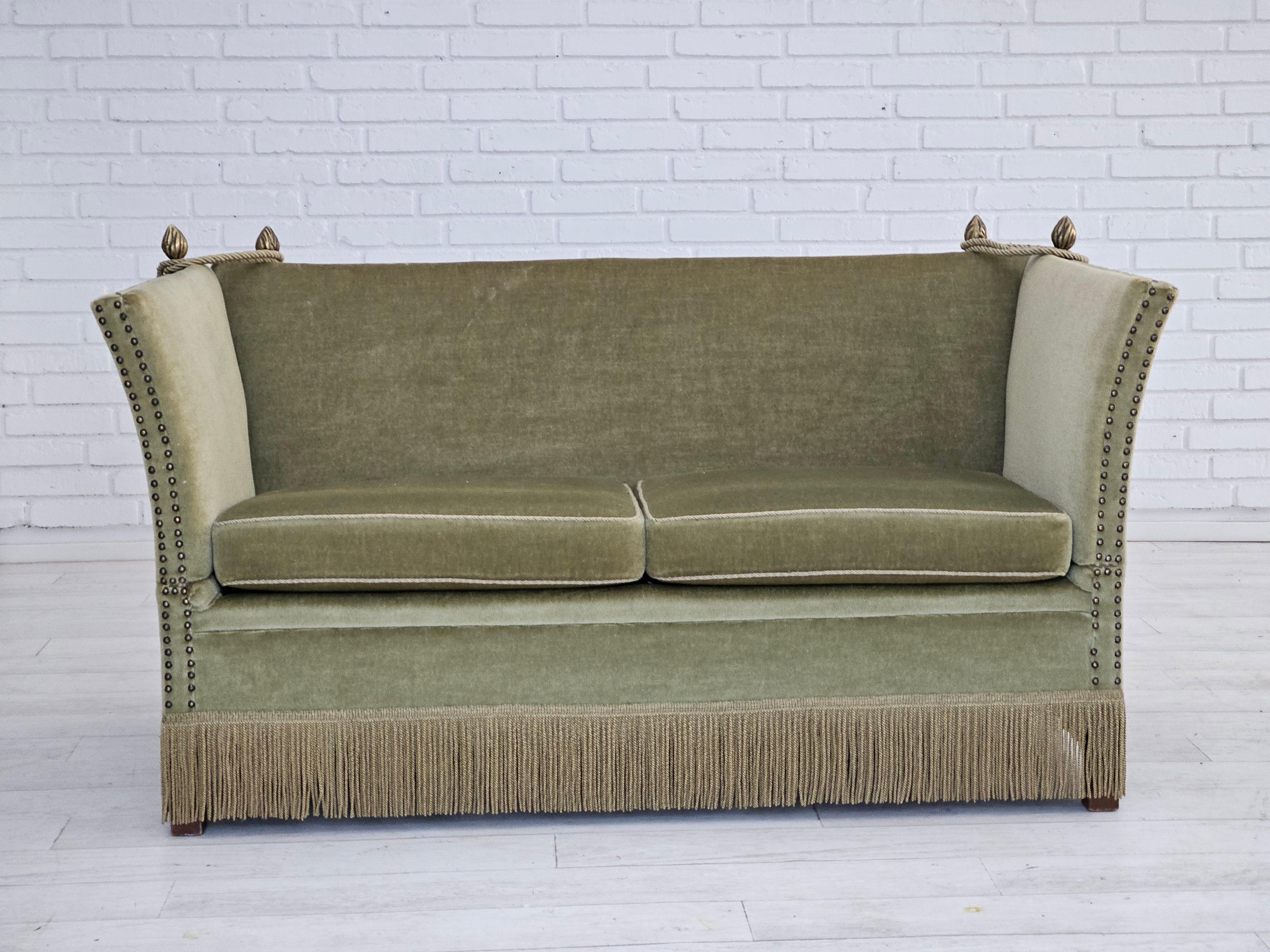 1950s, Danish drop-arm 2 seater sofa in original very good condition: no smells and no stains. Light green velour. Removable seat cushions. Manufactured by Danish furniture manufacturer in about 1960s. Three adjustments positions in each arm. Beech