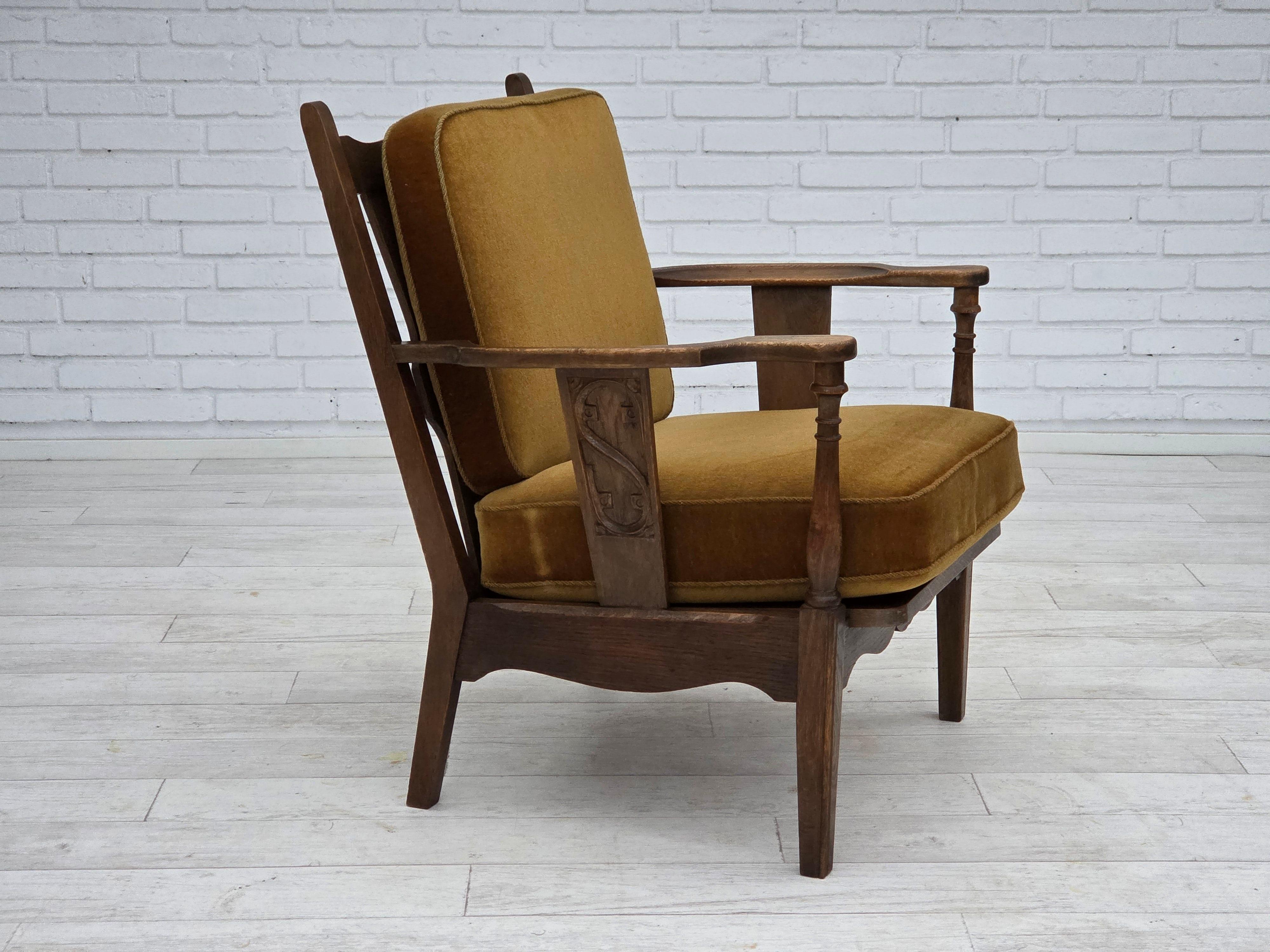 1950s, Danish vintage armchair. Original green furniture velour, oak wood, springs in the seat cushions. Original good condition: no smells, no stains and stable construction. Manufactured by Danish furniture maker in about 1950-55s. Original