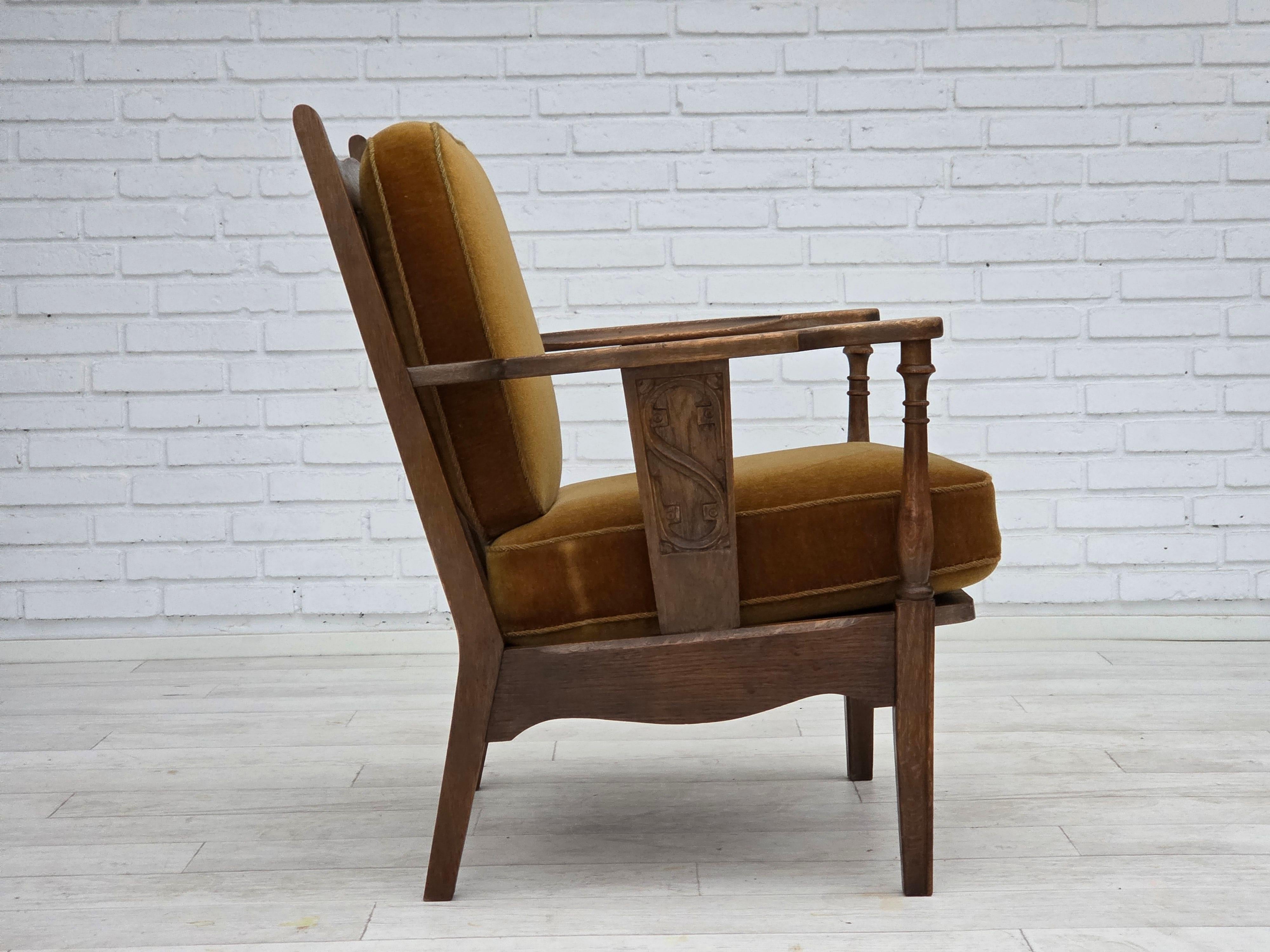 Mid-20th Century 1950s, Danish vintage armchair, original green furniture velour, oak wood. For Sale