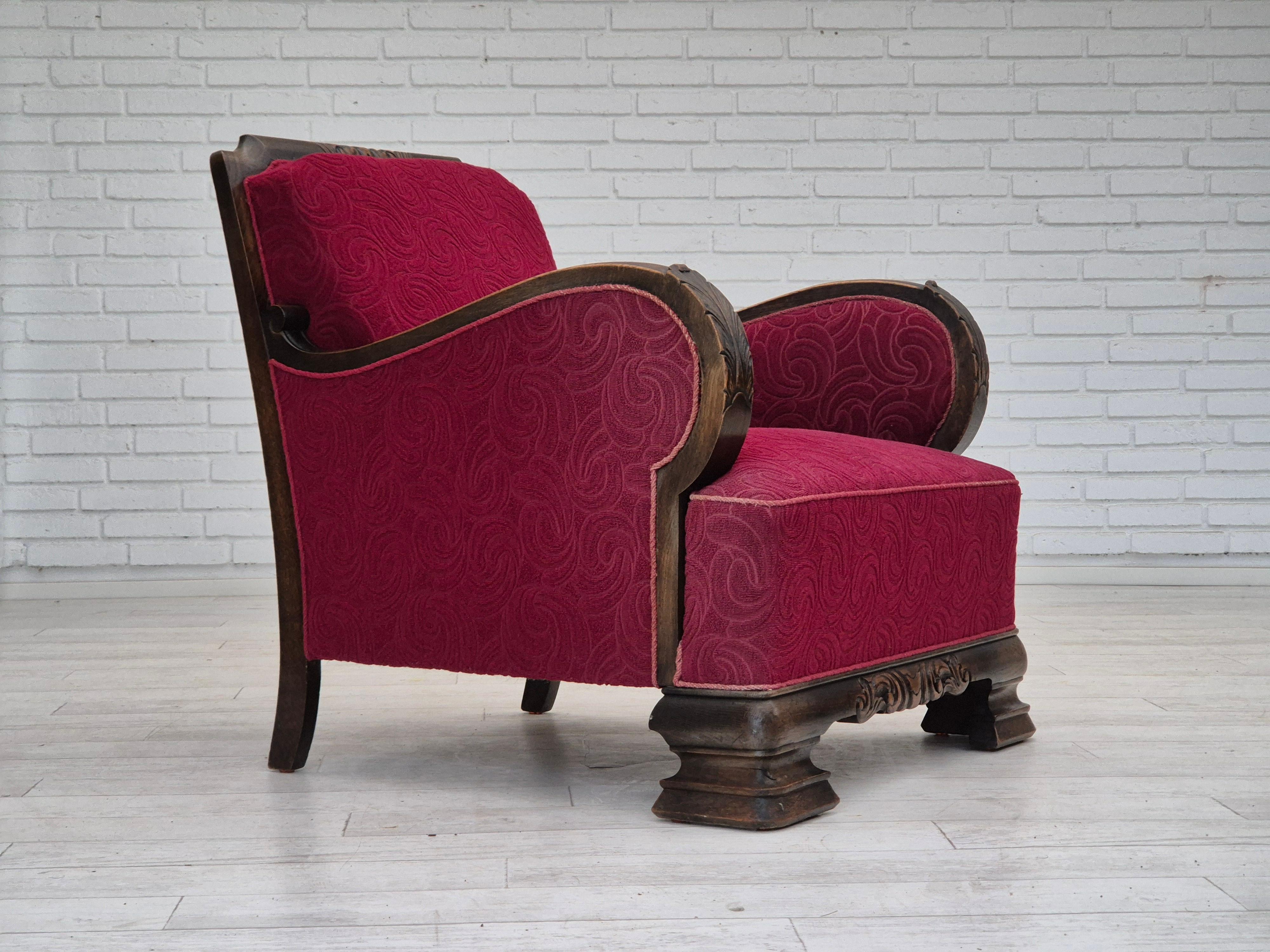 1950s, Danish relax chair in original good condition. Red furniture fabric, solid oak wood, brass springs in the seat and back. No smells, no stains, and stable construction. Manufactured by Danish furniture maker in about 1950-55s. Original