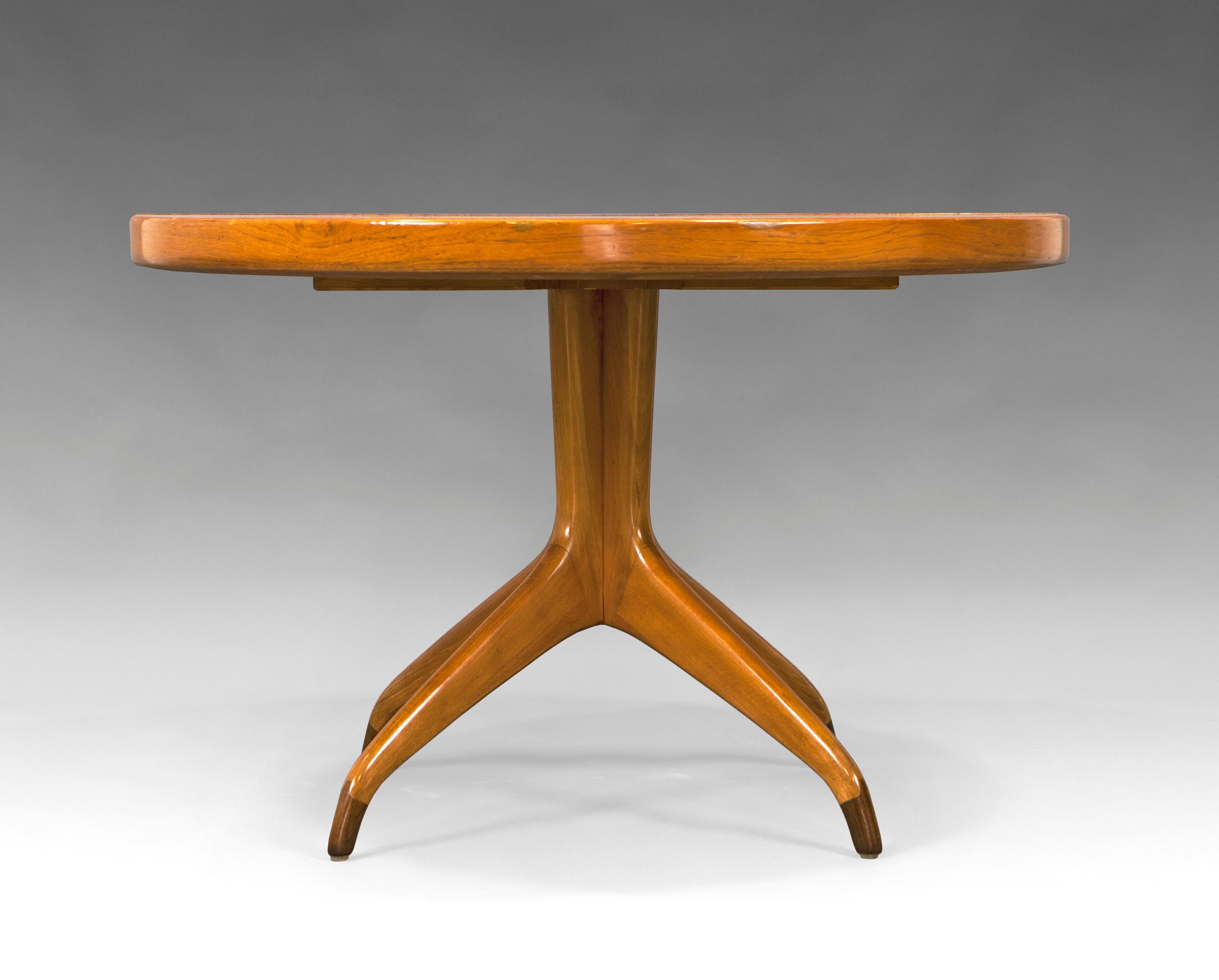Dining table designed by David Rosen for Nordiska Kompaniet. Sweden, 1950s. Teak wood with rosewood details.
