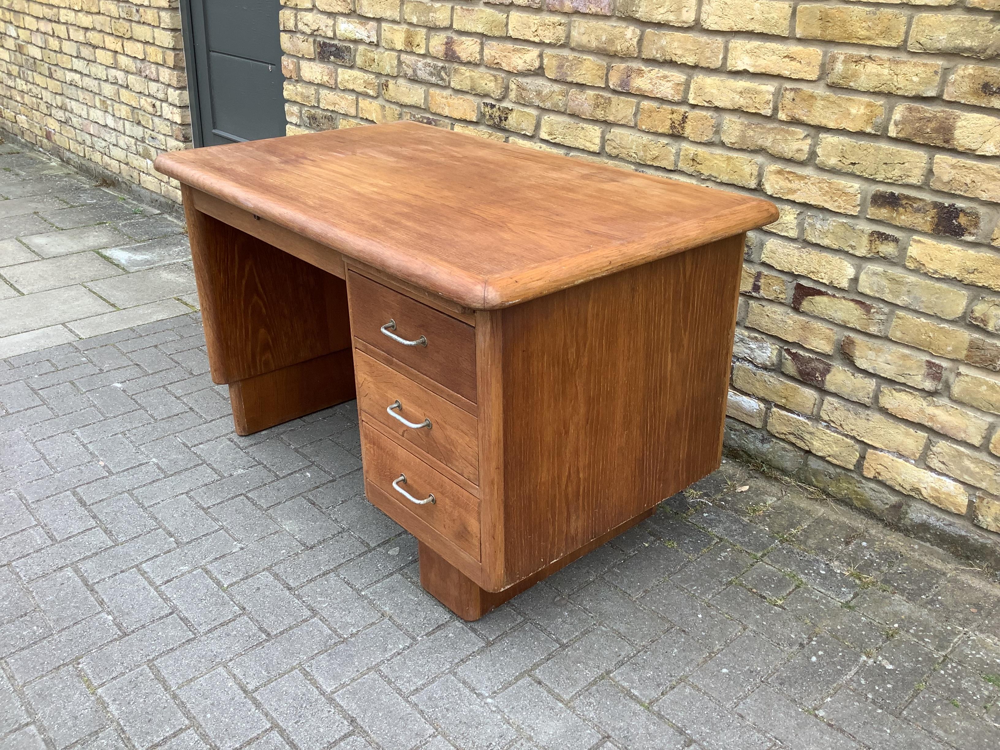 Solid oak Deco style French writing desk good work surface rounded curved shaped design. 4 storage draws with centre draw.