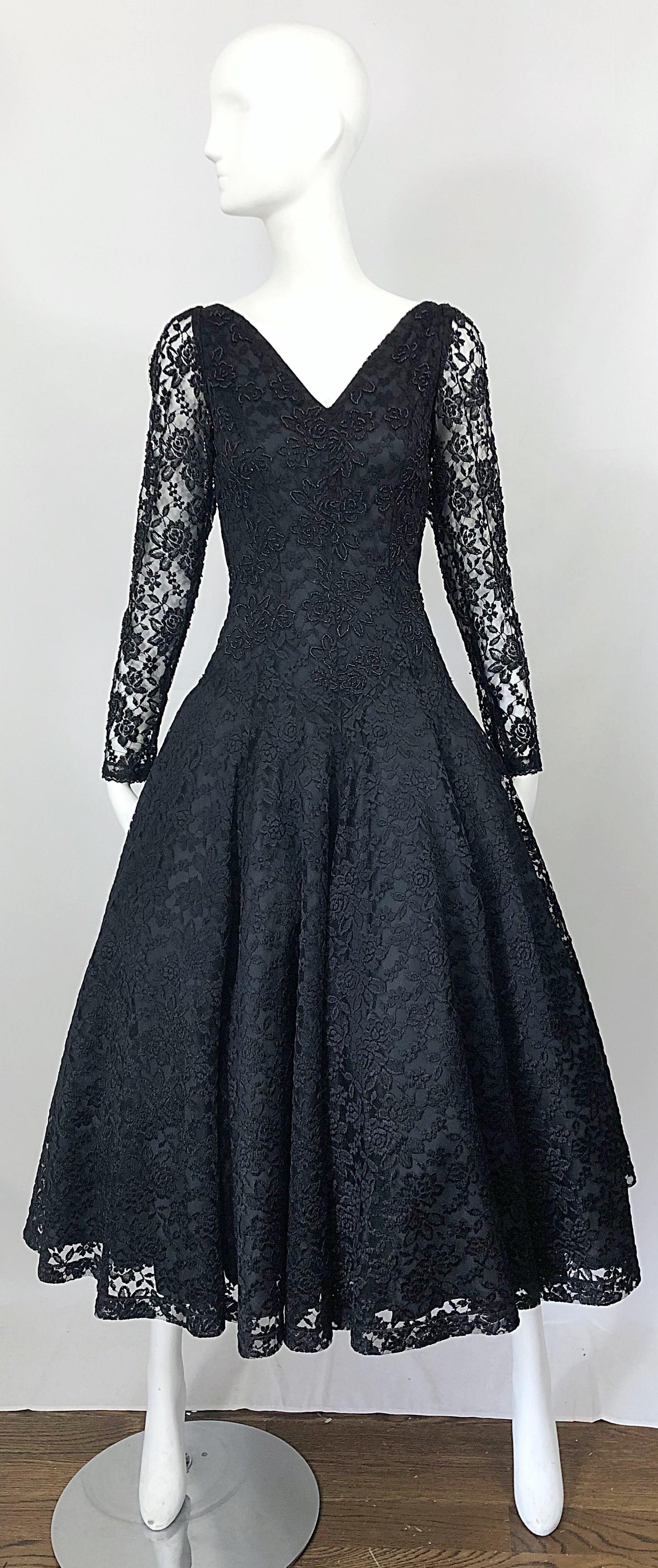 Stunning 1950s demi couture black chantilly lace beaded long sleeve fit n' flare dress! There are so many details on this beauty! Tailored bodice with thousands of hand-sewn black seed beads throughout the bodice. Amazing full skirt can easily fit a