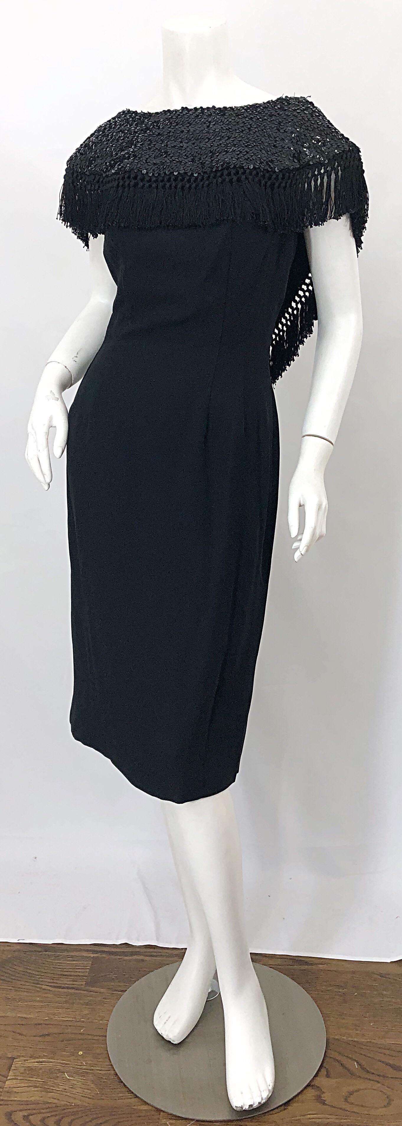 Wonderful 50s black silk crepe dramatic neck sequin wiggle dress! Features a shawl like collar drenched with thousands of hand-sewn black sequins. Dipped low back reveals just the right amount of skin. Full metal zipper up the back with hook-and-eye