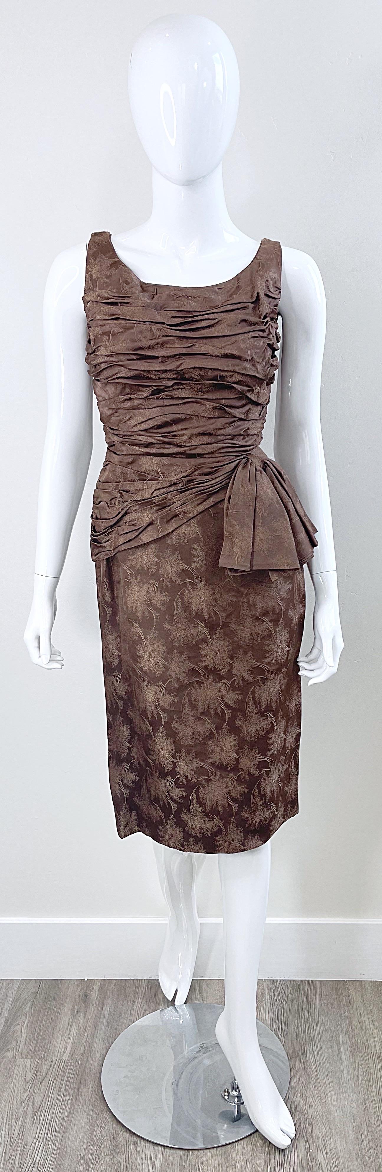 Beautiful 1950s taupe / light brown silk brocade sleeveless wiggle dress ! The perfect color for anytime of year for ay day or evening event. Flattering tailored ruched bodice with full metal zipper up the back and hook-and-eye closure. Sash at left