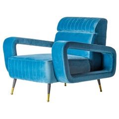 Fauteuil design et style vintage des années 1950 en velours bleu et pieds noirs