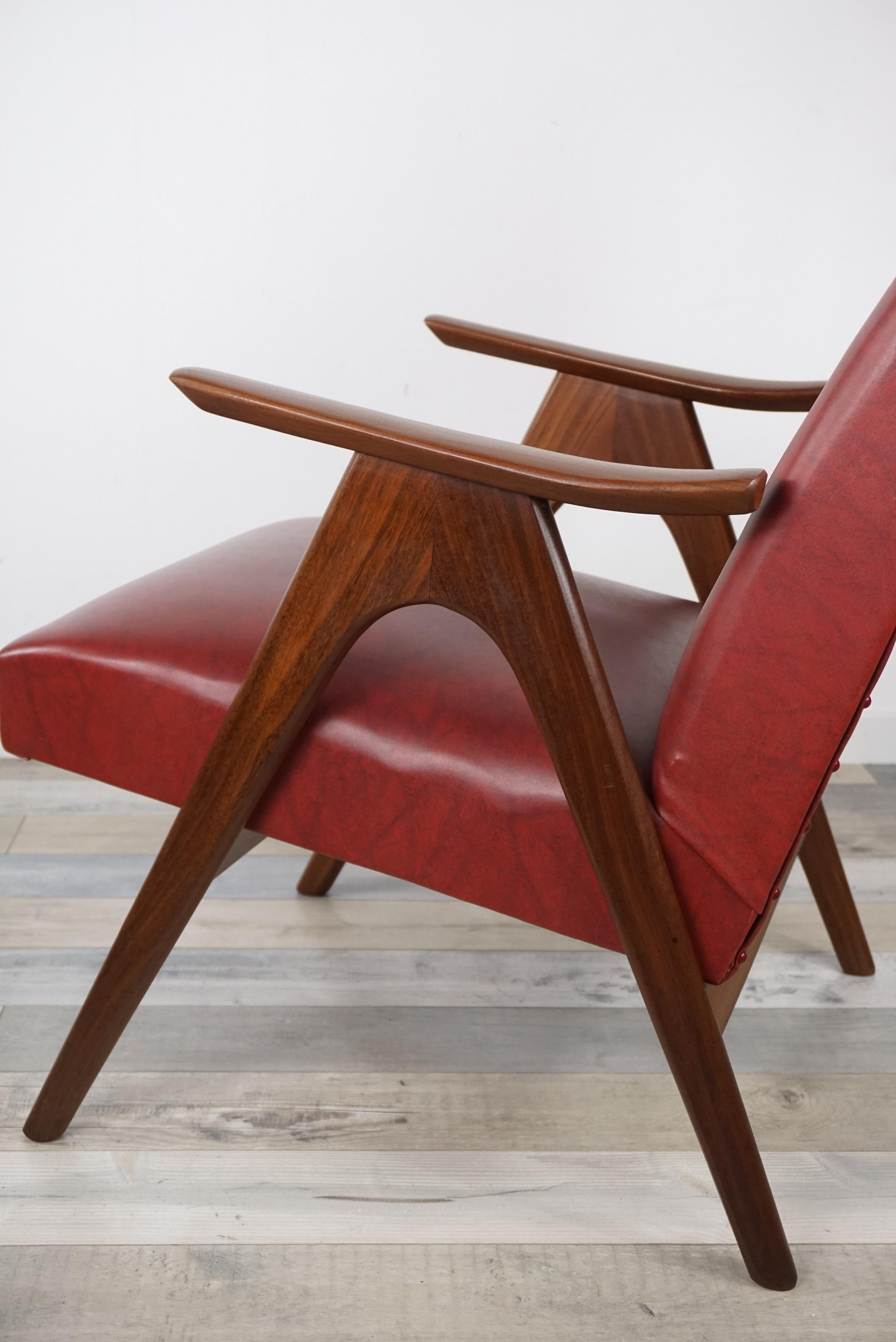 Pair of armchairs from the 1950s - 1960s design by Louis Van Teeffelen: a beautiful couple with teak structure, hull dressed in imitation leather burgundy. One high back (H94 / 58 cm / 50 cm) the other smaller (H82 cm / 58 cm / 50 cm) The seat