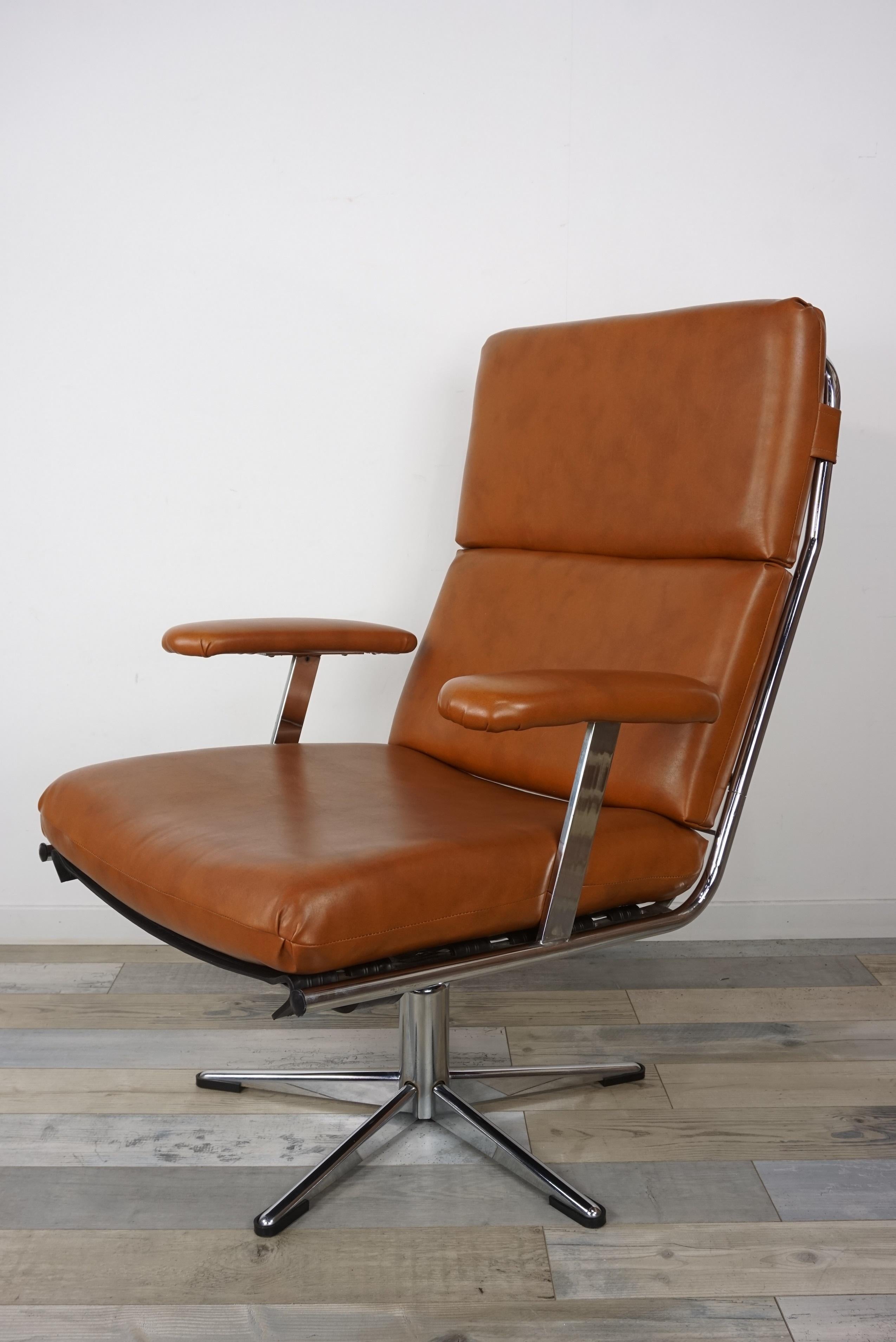 Pair of lounge armchairs from the 1950s-1960s with a tubular chrome overlay structure lined with cognac colored leather (the seat and back cushions are removable). Retro look, beautiful quality, the height of the armrests is 60 cm, the seat height