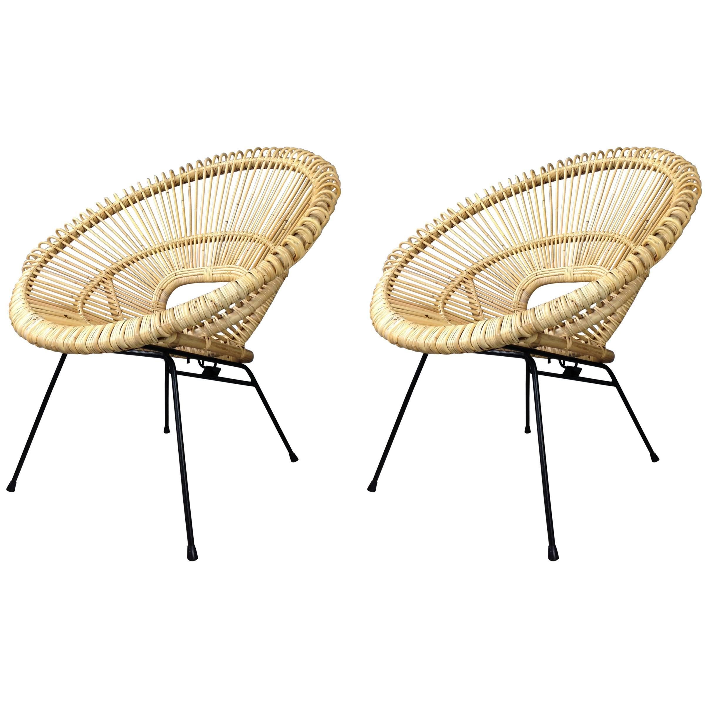 1950s design style rattan and black metal pair of lounger armchairs at the manner of Janine Abraham and Dirk Jan Rol.
  