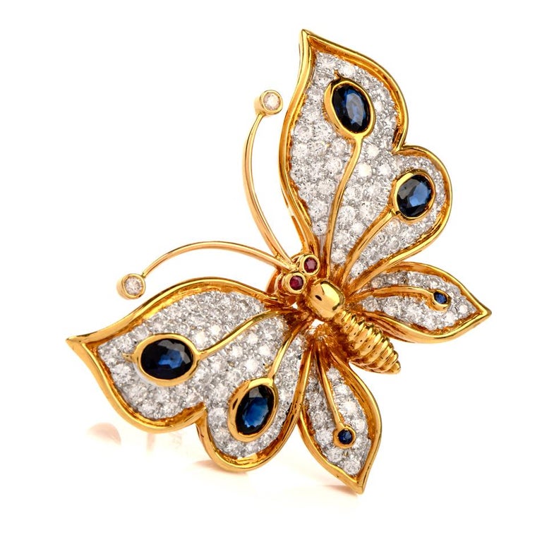 This beautiful designer vintage butterfly pin brooch is crafted in solid 18-karat yellow gold, It is extremely well made , weighing 15.6 grams and measuring 44mm wide x 33mm high. Wings are pave-set with 122 round diamonds, collectively weighing