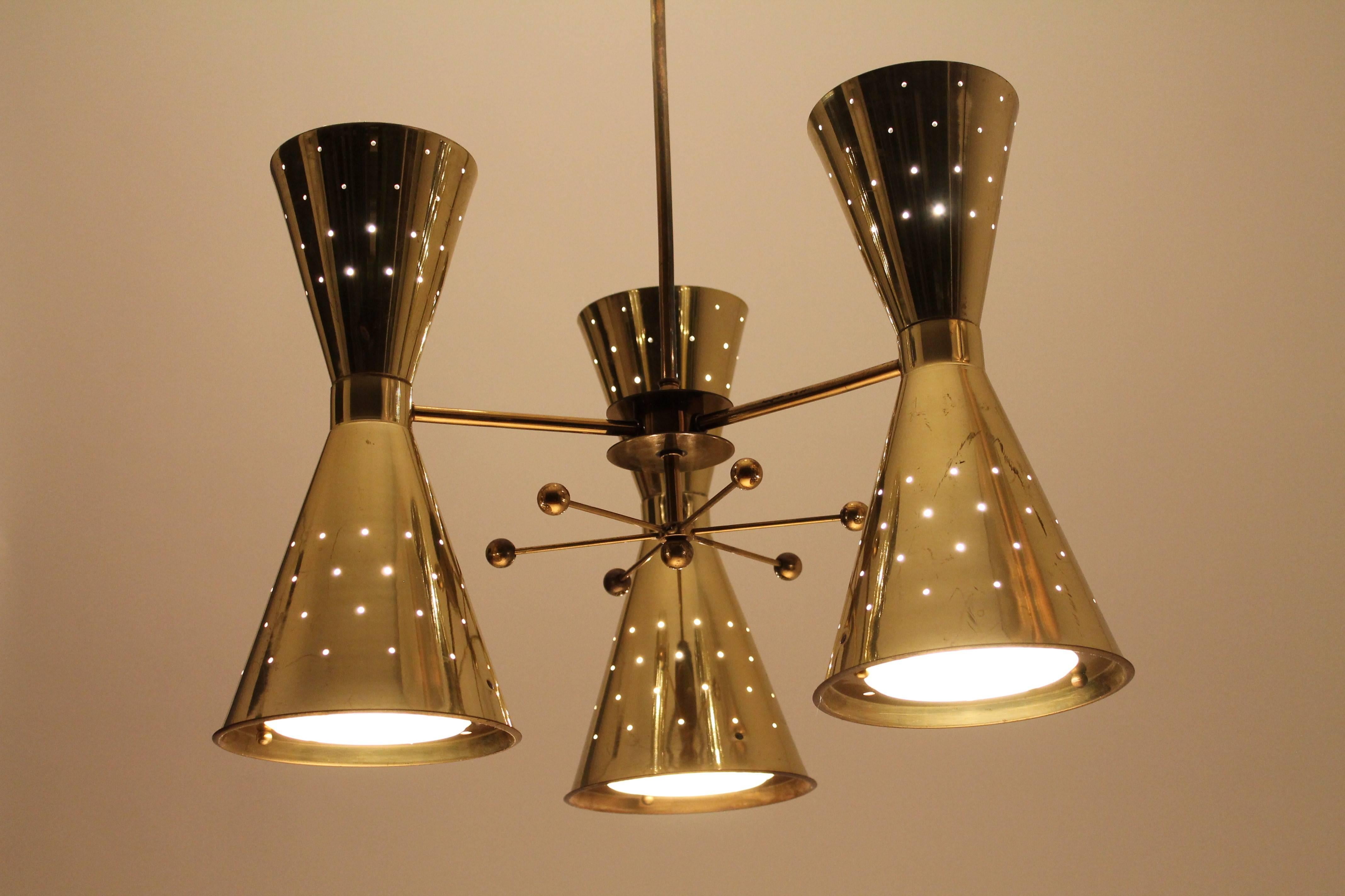 Mid-Century Modern 1950s Diabolo, Hourglass Pierced Brass-Plated Chandelier with Glass Lens