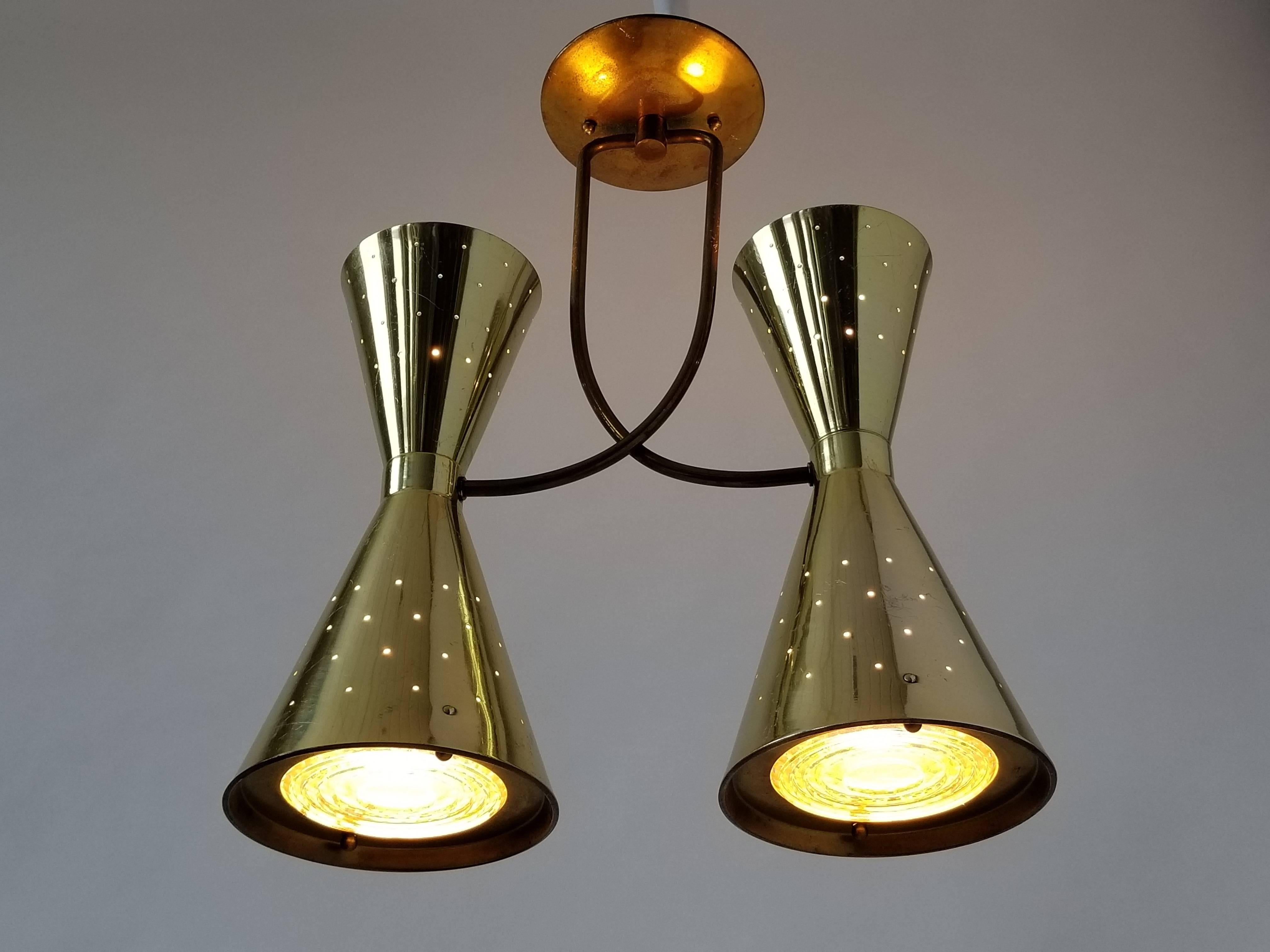 Each gently pierced brass plated shade are 14 inches high by 6.75 inches diameter for the lower portion. Supportive rods is made of brass.

Under each shade, there is glass lens (fresnel) that disperse light evenly . An outer ring held by two