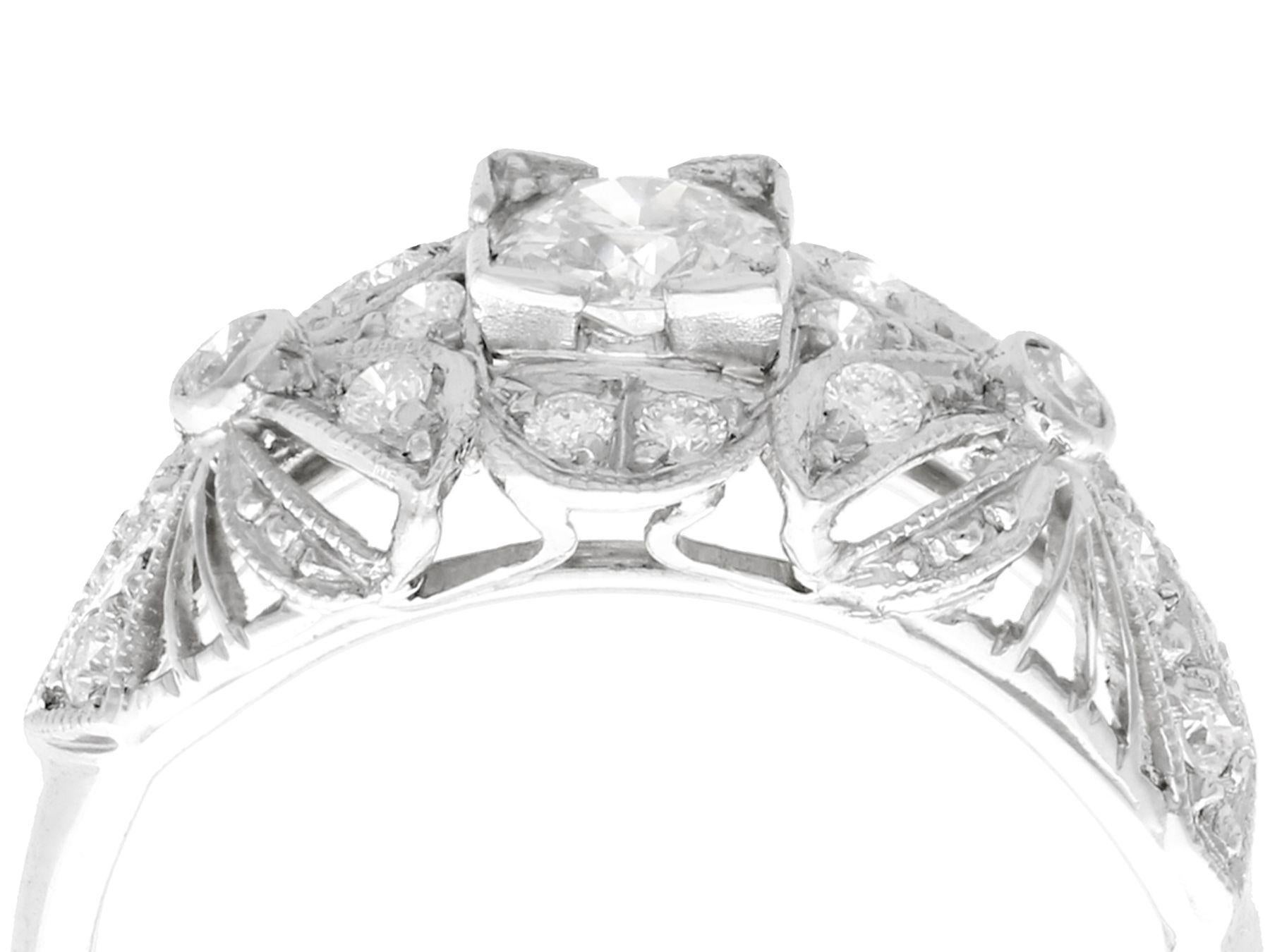 An impressive vintage 1950s 0.65 carat diamond and platinum dress ring; part of our diverse diamond jewelry collections.

This fine and impressive vintage 1950s diamond ring has been crafted in platinum.

The ornate pierced decorated design displays