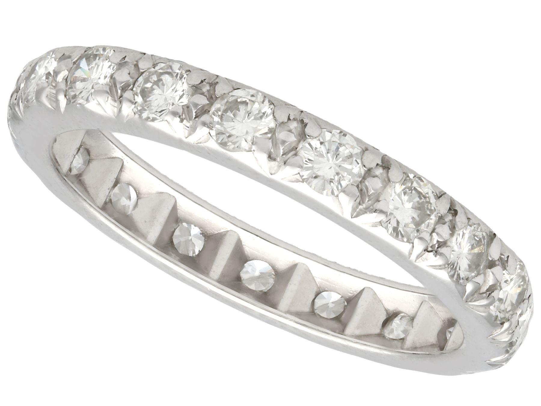 This fine and impressive vintage diamond eternity ring has been crafted in platinum.

The ring is embellished with twenty-five pavé set diamonds in a combination of Old European round and old mine cuts.

The eternity ring is plain and
