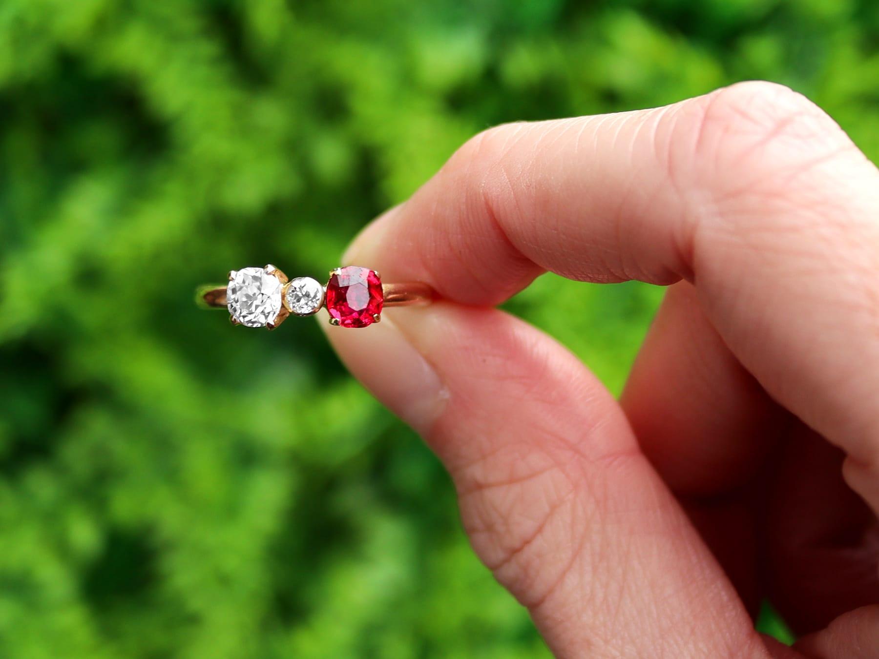 An impressive vintage 1950s 0.64 carat diamond and 0.45 carat ruby, 15 karat yellow gold cocktail ring; part of our diverse antique jewelry collections.

This fine and impressive ruby and diamond ring has been crafted in 15k yellow gold.

The simple