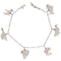 Vintage 1950s Diamond and Ruby Animal Charm Bracelet Set in Platinum