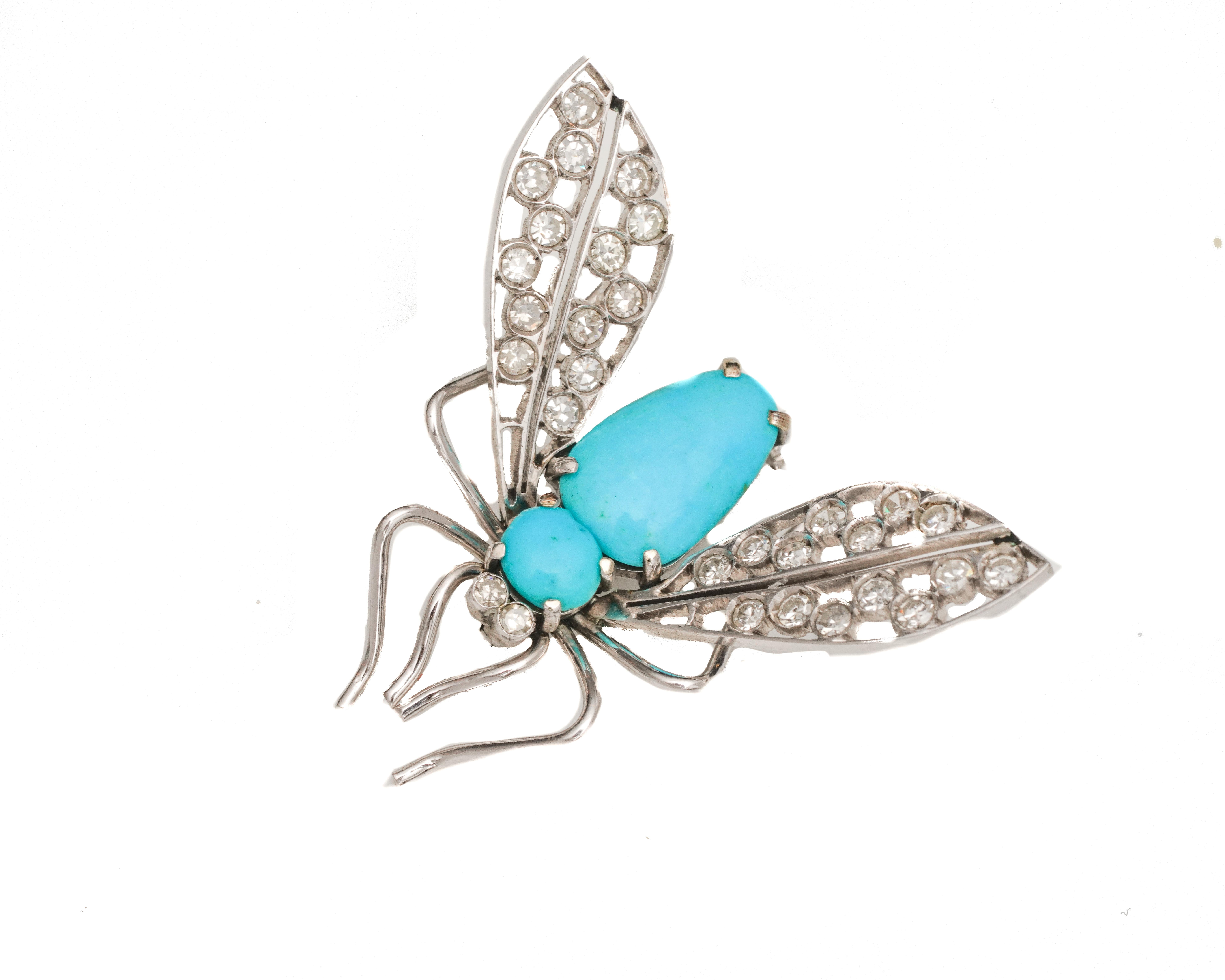 Item Details:
Metal type: 14 Karat White Gold & Platinum 
Weight: 5.7 grams
Measures 2 inch width x 2 inch length 

Features:
Body of insect made of Turquoise gemstone 
Wings of insect made of Single Cut Diamonds

Diamond Details:
Cut: Single