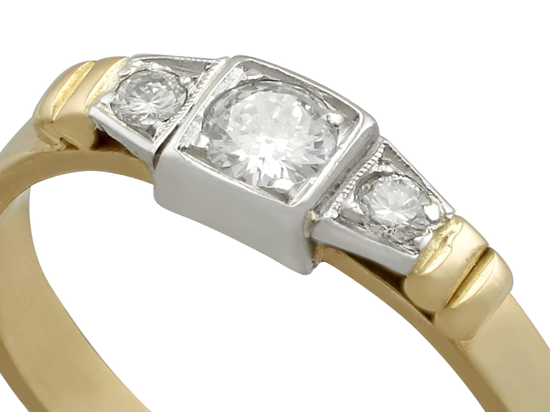 A fine and impressive vintage 0.43 carat diamond and 18 karat yellow gold, 18 karat white gold set three stone ring; part of our vintage jewelry and estate jewelry collections

This fine and impressive vintage 1950s diamond ring has been crafted in