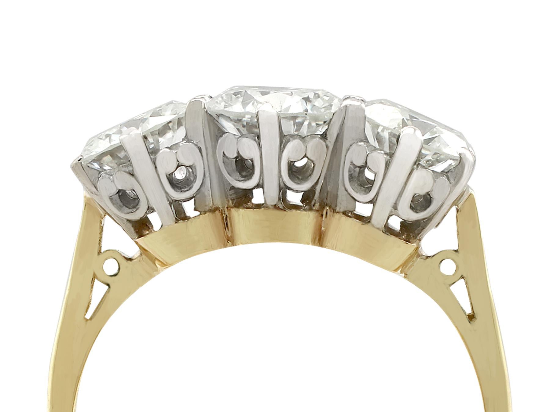 An impressive vintage 2.34 carat diamond and 18 karat yellow gold, 18 karat white gold set trilogy ring; part of our diverse diamond jewellery and estate jewelry collections.

This fine and impressive vintage trilogy diamond ring has been crafted in