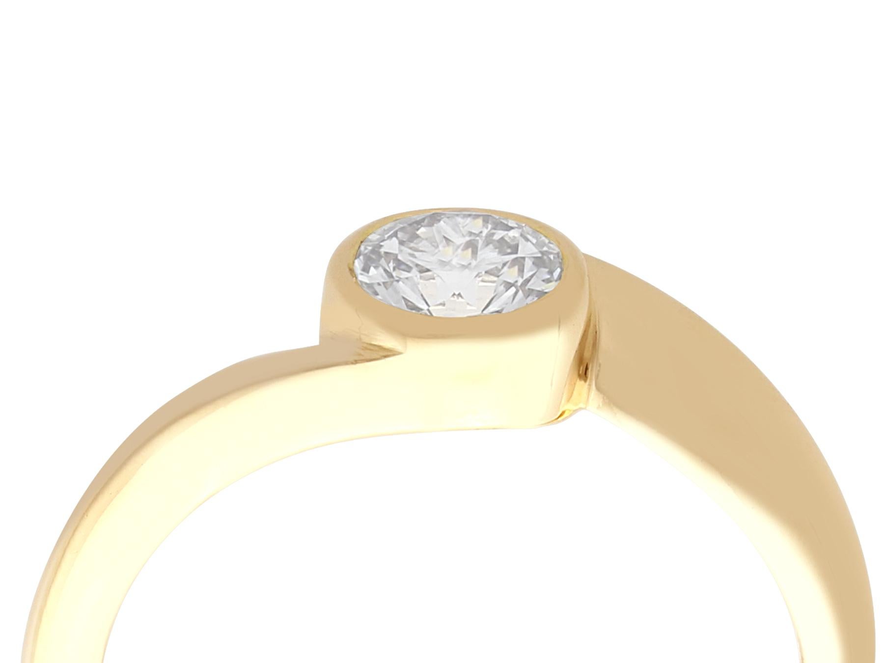 A fine and impressive vintage French 0.51 carat diamond and 18 karat yellow gold solitaire twist ring; part of our diverse jewelry and estate jewelry collections.

This fine and impressive vintage engagement ring has been crafted in 18k yellow