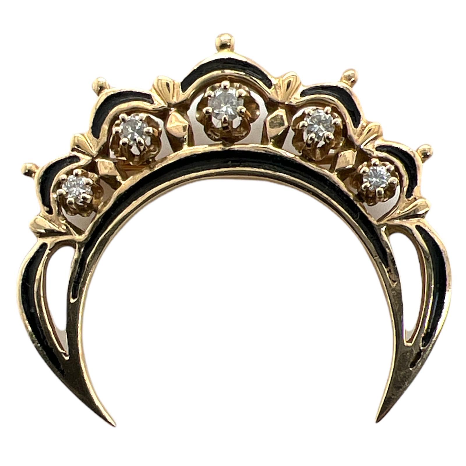 Diamond and black enamel vintage crescent can be worn as a pendant or brooch. The pendant features 5 diamonds weighing approximately .23 carat total weight and graded H-I color and SI clarity. The crescent is handcrafted in 14 karat yellow gold and