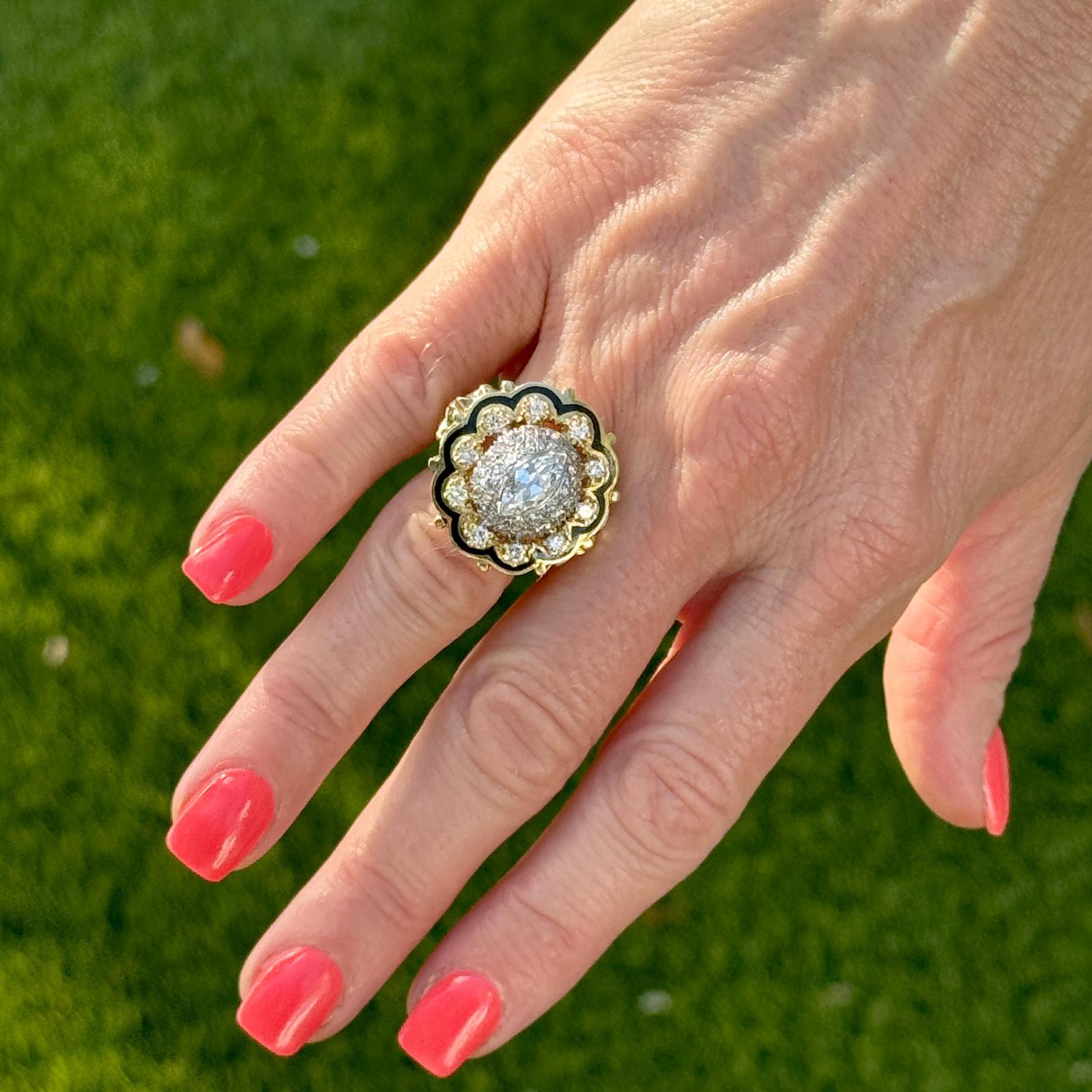 This striking cocktail ring from the 1950s is a stunning blend of bold design and timeless elegance, crafted in 14 karat yellow gold. At the heart of the ring lies a captivating marquise-cut diamond (weighing approximately .65 carat), known for its