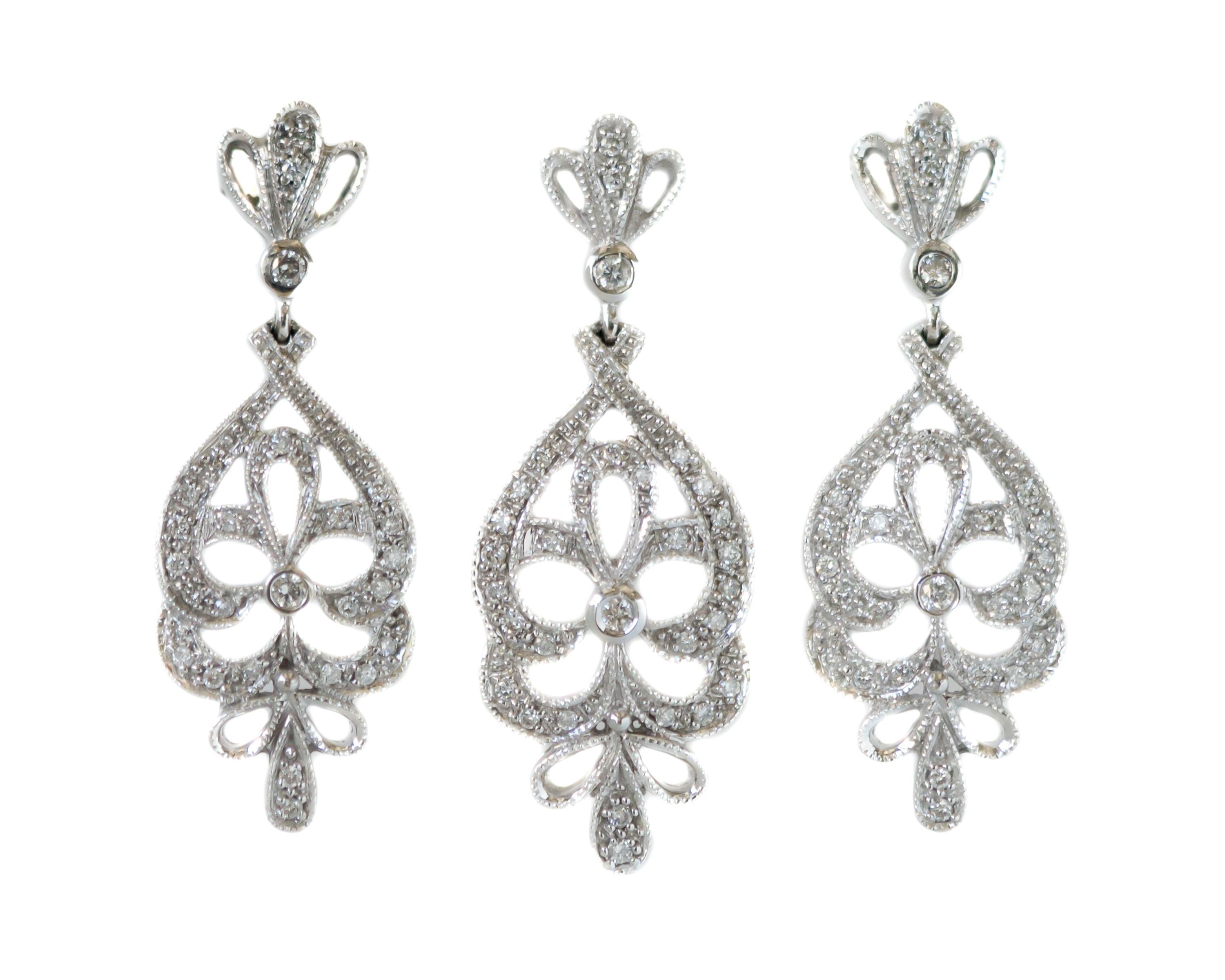 1950s 3.0 carat total Diamond Chandelier Necklace and Earring Set - 14 Karat White Gold, Diamonds

Features:
3.0 carat total Diamonds
14 Karat White Gold Setting and Wheat Chain
Chandelier Earrings with Matching Necklace
Made in Italy
Sliding